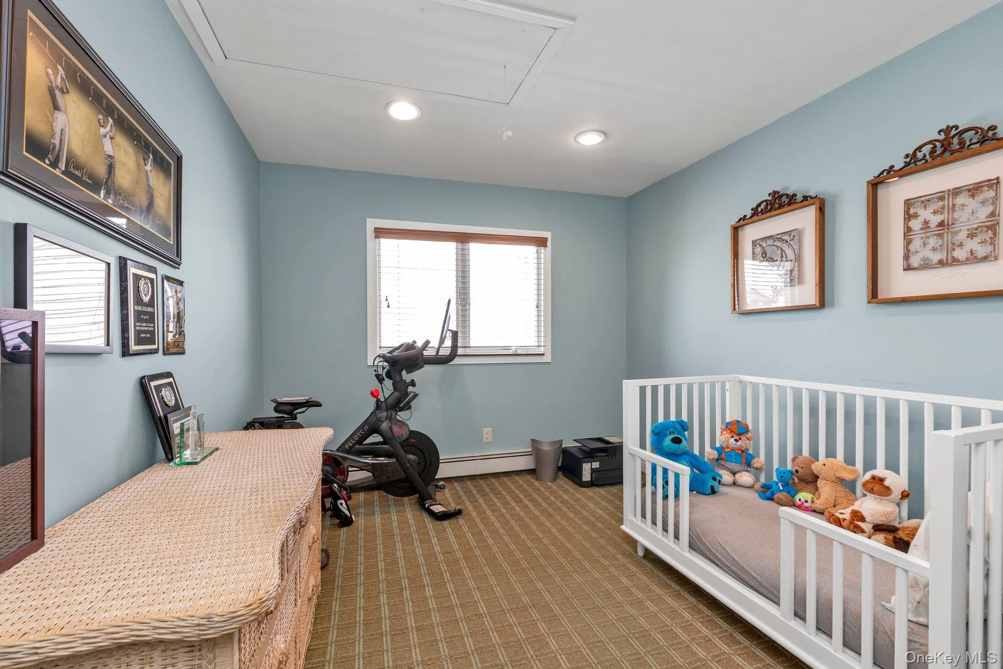 Bedroom featuring recessed lighting, a single window with blinds, and striped carpeting Bedroom featuring recessed lighting, a single window with blinds, and striped carpeting