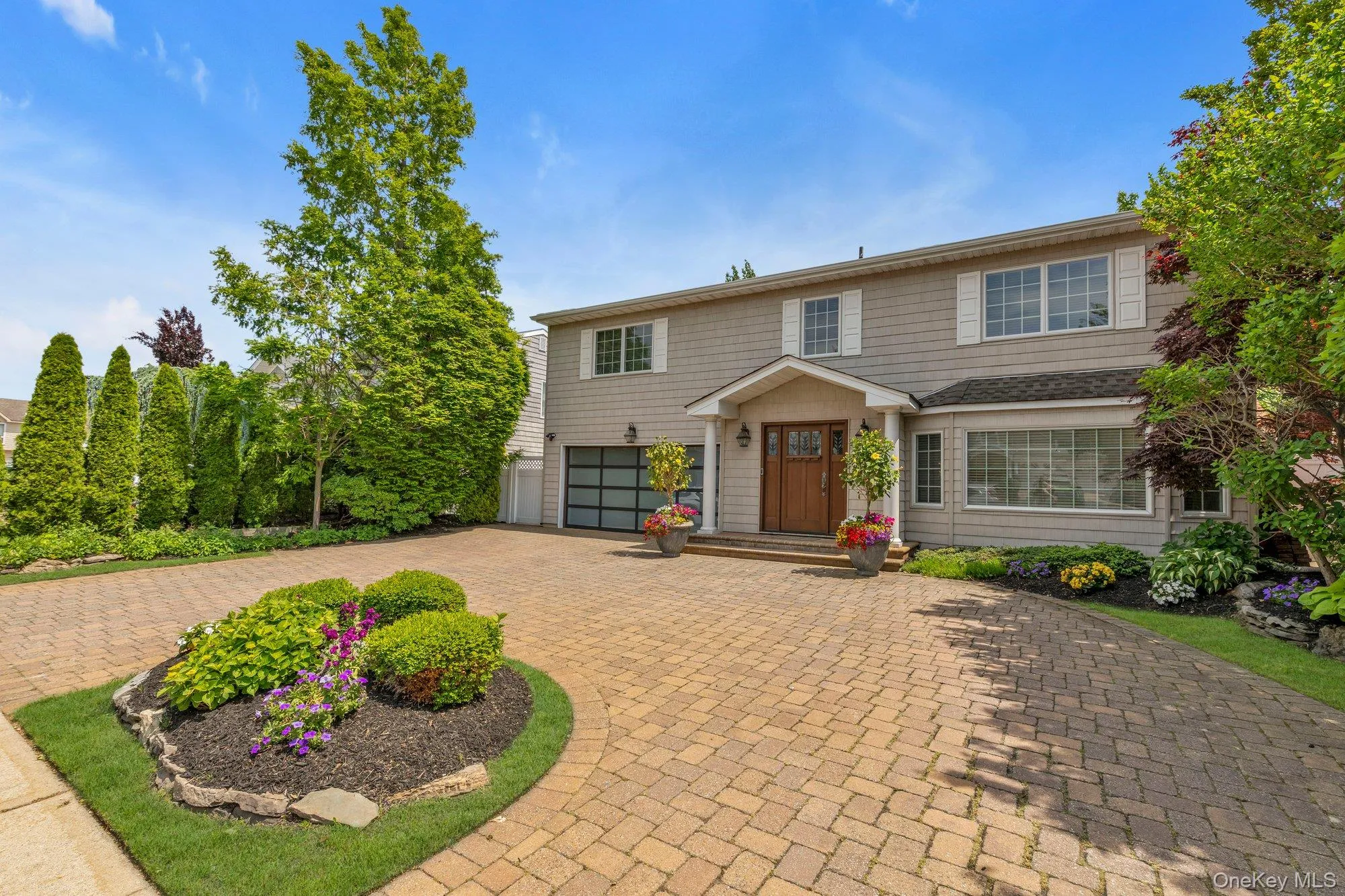 Two-story residence featuring siding with white trim and shutters Two-story residence featuring siding with white trim and shutters