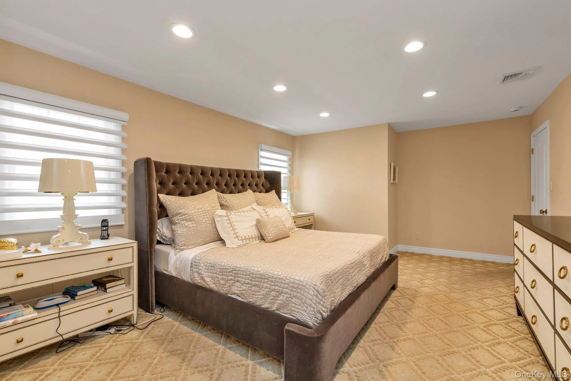Carpeted room featuring recessed lighting and neutral-toned walls Carpeted room featuring recessed lighting and neutral-toned walls