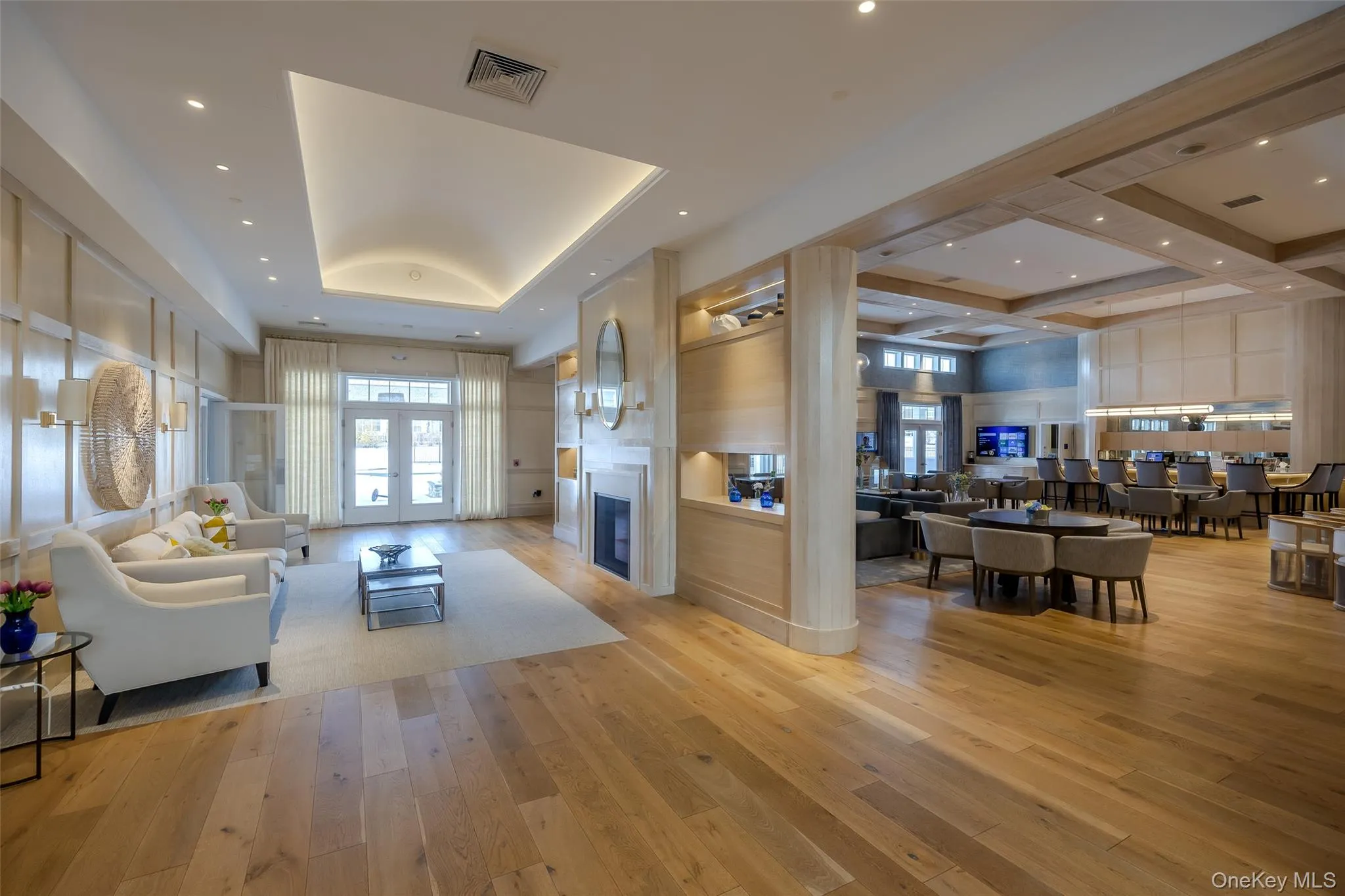 Community lobby featuring recessed lighting, a towering ceiling, and coffered ceiling Community lobby featuring recessed lighting, a towering ceiling, and coffered ceiling