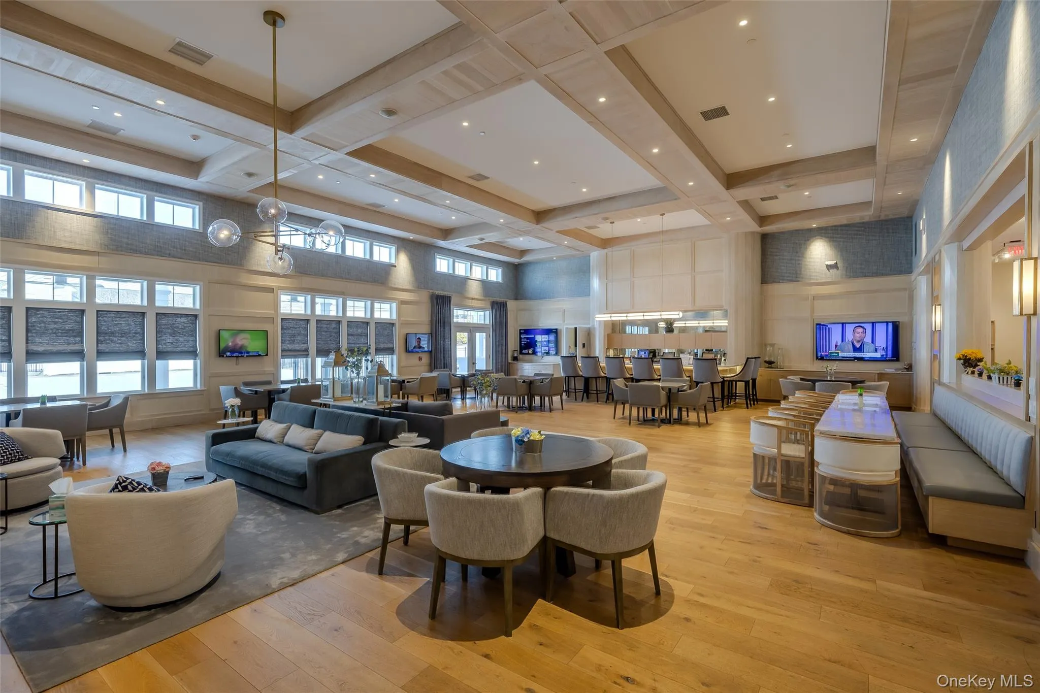 Lobby featuring a towering ceiling, coffered ceiling, and beamed ceiling Lobby featuring a towering ceiling, coffered ceiling, and beamed ceiling