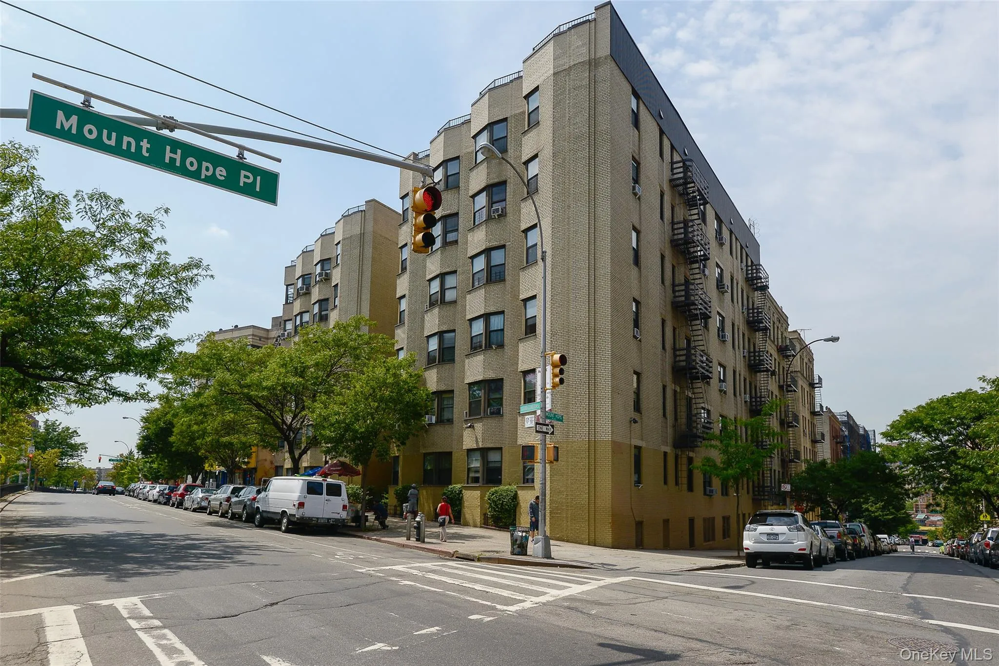 1855 GRAND CONCOURSE @ Mount Hope Place, Bronx, NY 10453 - Exterior façade of Art Deco elevator apartment building featuring a distinctive, cream-colored brick zigzagged façade attributed to architect Thomas Dunn ca. 1936. 1855 GRAND CONCOURSE @ Mount Hope Place, Bronx, NY 10453 - Exterior façade of Art Deco elevator apartment building featuring a distinctive, cream-colored brick zigzagged façade attributed to architect Thomas Dunn ca. 1936.