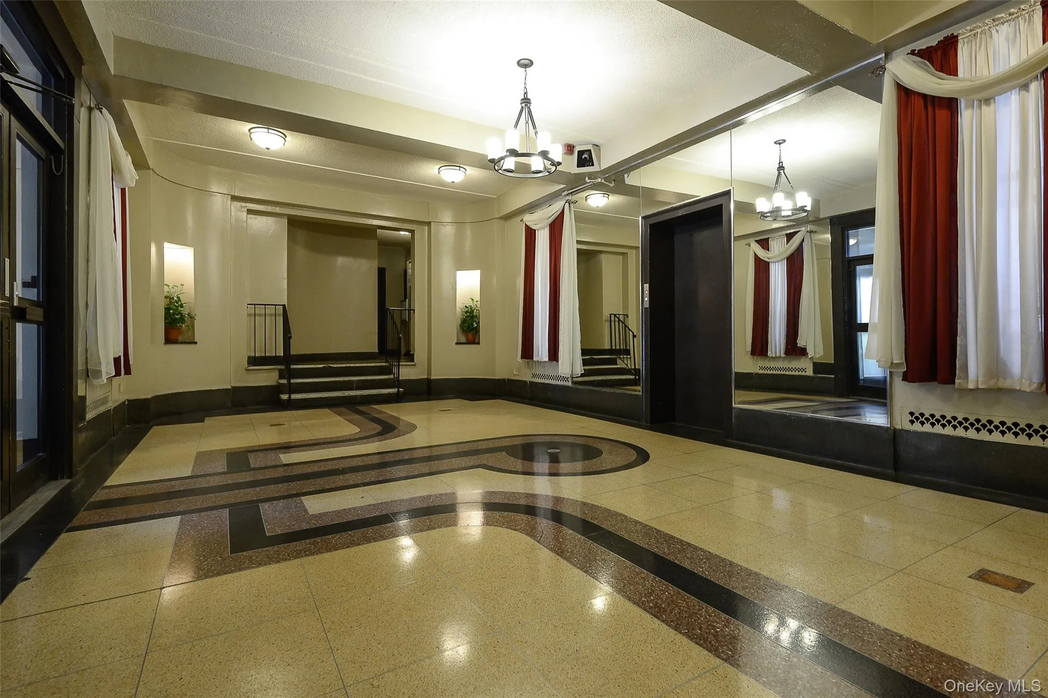 1855 GRAND CONCOURSE @ Mount Hope Place, Bronx, NY 10453 - Main Lobby featuring a dramatic, stylized Art Deco "Machine Age" terrazzo floor typical of the period. 1855 GRAND CONCOURSE @ Mount Hope Place, Bronx, NY 10453 - Main Lobby featuring a dramatic, stylized Art Deco "Machine Age" terrazzo floor typical of the period.