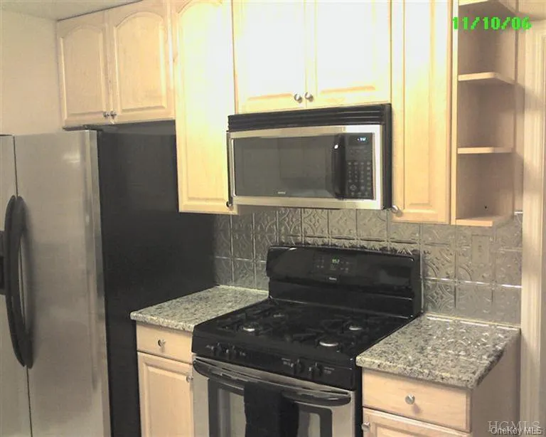 Modern, fully-renovated kitchen with granite countertops, stainless appliances, built-in microwave/range hood, and lots of cabinetry Modern, fully-renovated kitchen with granite countertops, stainless appliances, built-in microwave/range hood, and lots of cabinetry