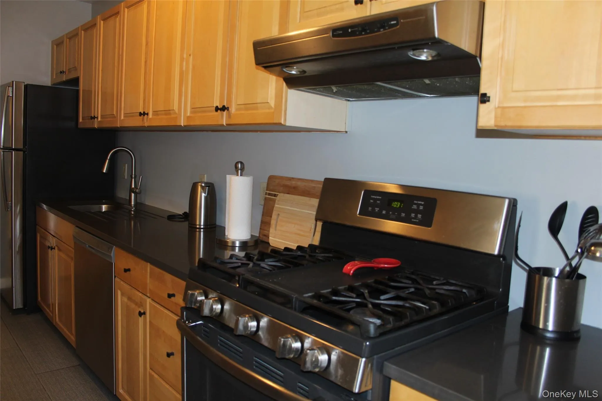 Quartz countertops and maple cabinets Quartz countertops and maple cabinets