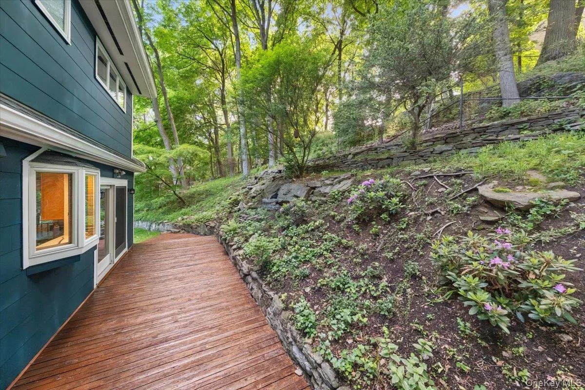 Newly stained deck, with sliding glass doors connecting to kitchen/dining area. Newly stained deck, with sliding glass doors connecting to kitchen/dining area.