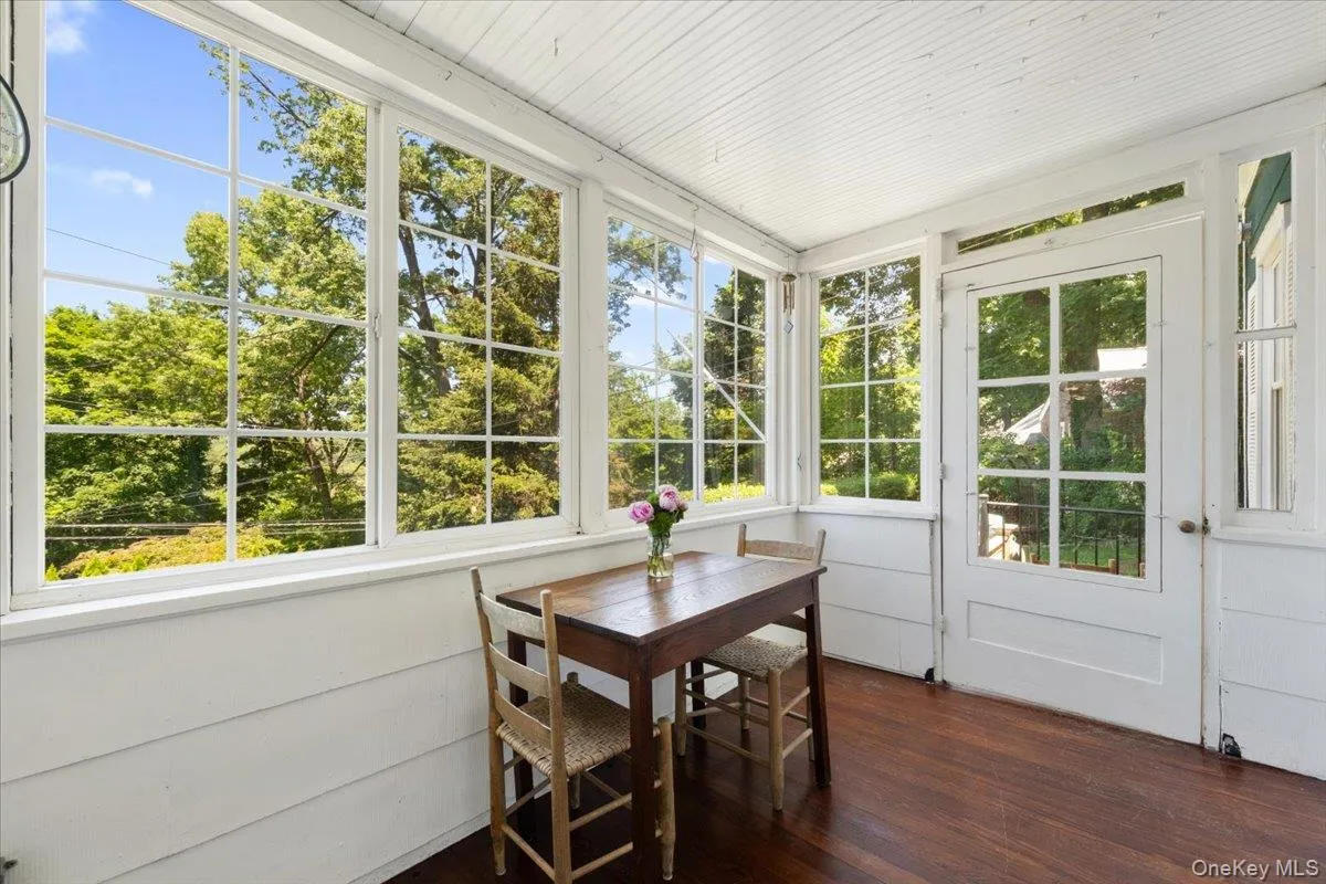 Entry sun room, perfect for morning coffee and enjoying the view. Entry sun room, perfect for morning coffee and enjoying the view.