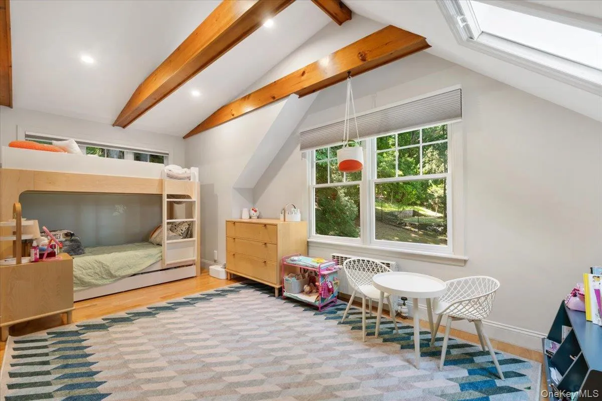 Sundrenched fourth bedroom on second floor, complete with skylight and wooden beamed ceilings. Sundrenched fourth bedroom on second floor, complete with skylight and wooden beamed ceilings.