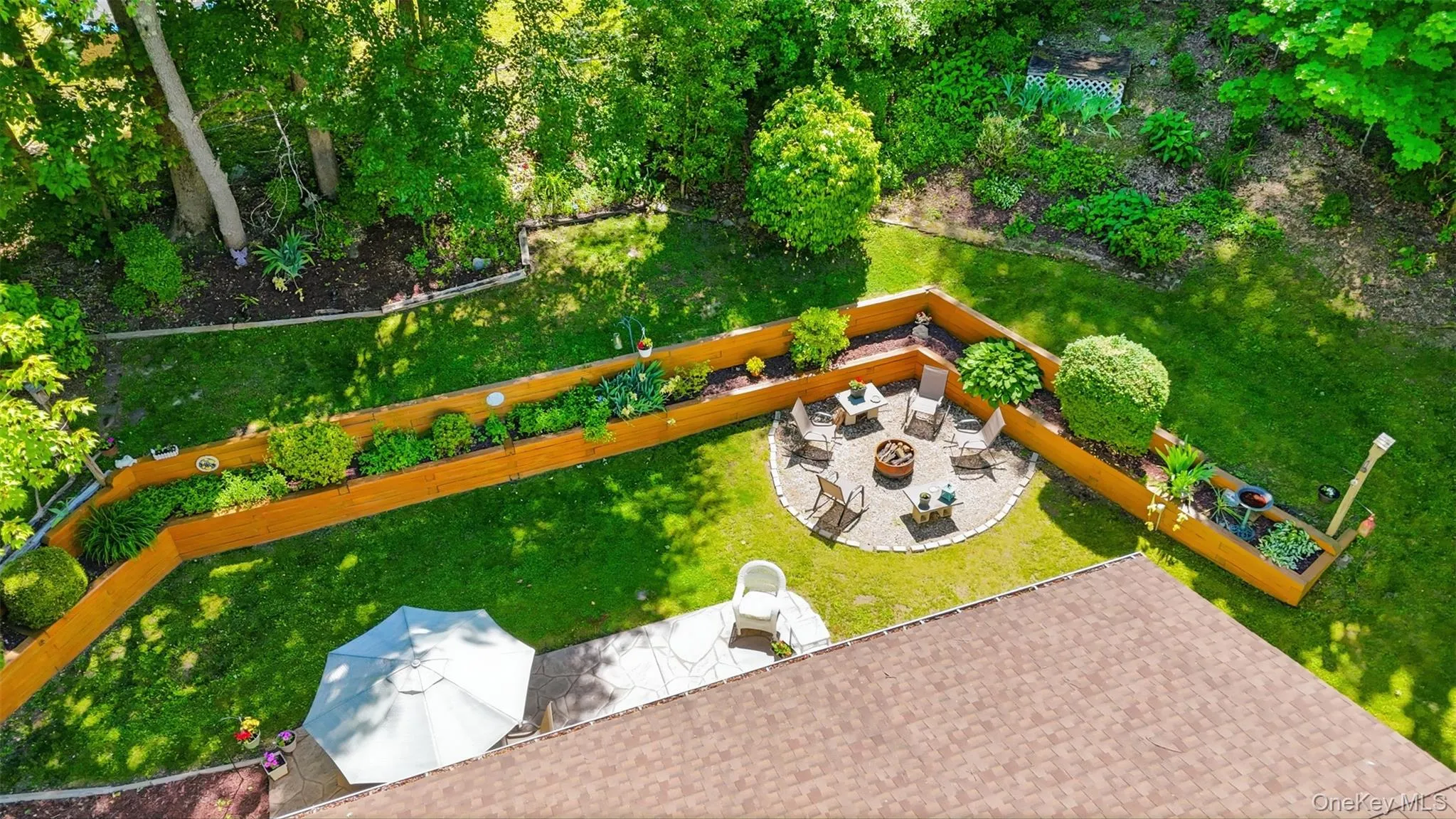 Park like setting in the backyard with patio. Park like setting in the backyard with patio.