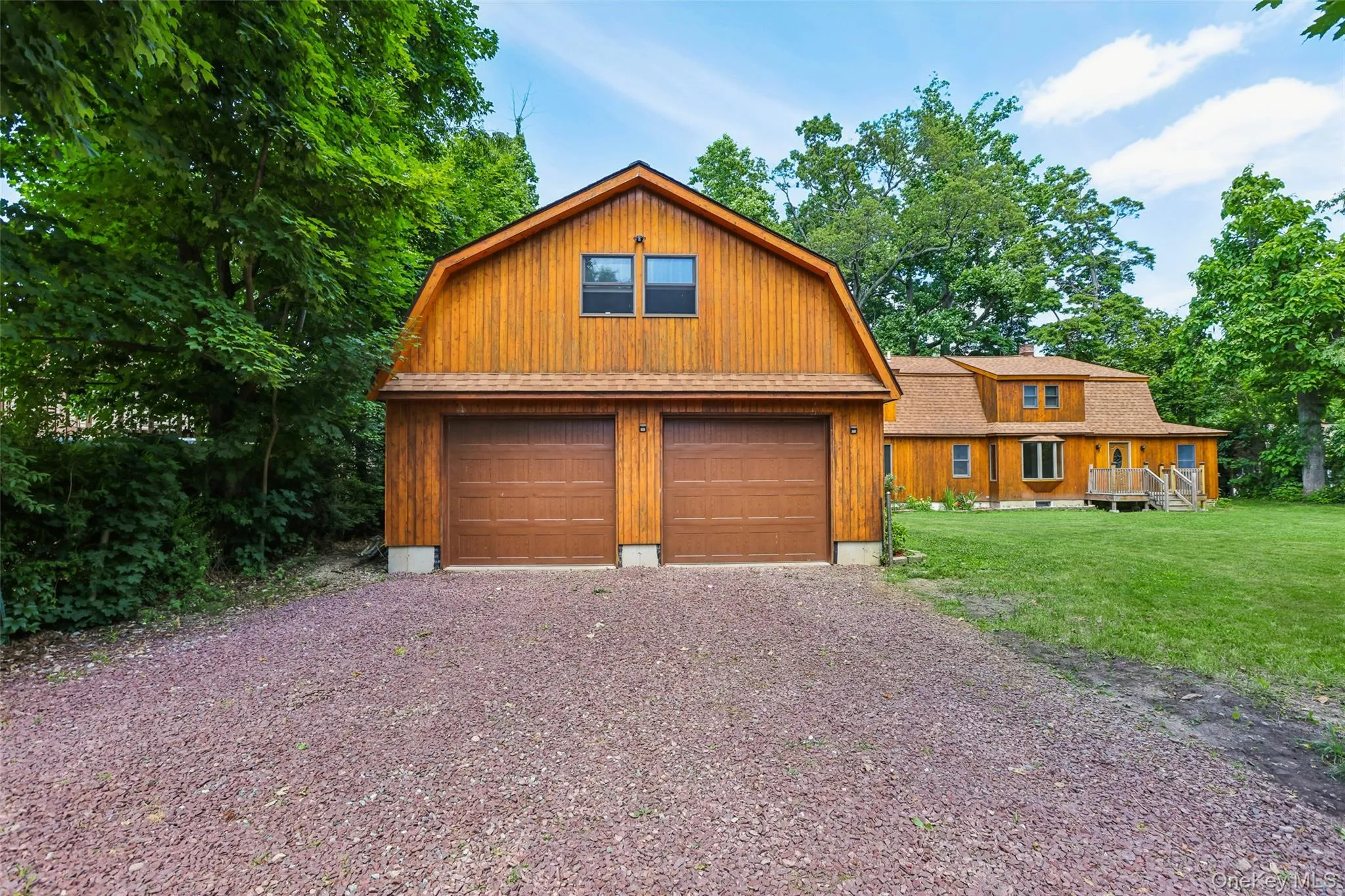 House and two car garage, gravel driveway House and two car garage, gravel driveway