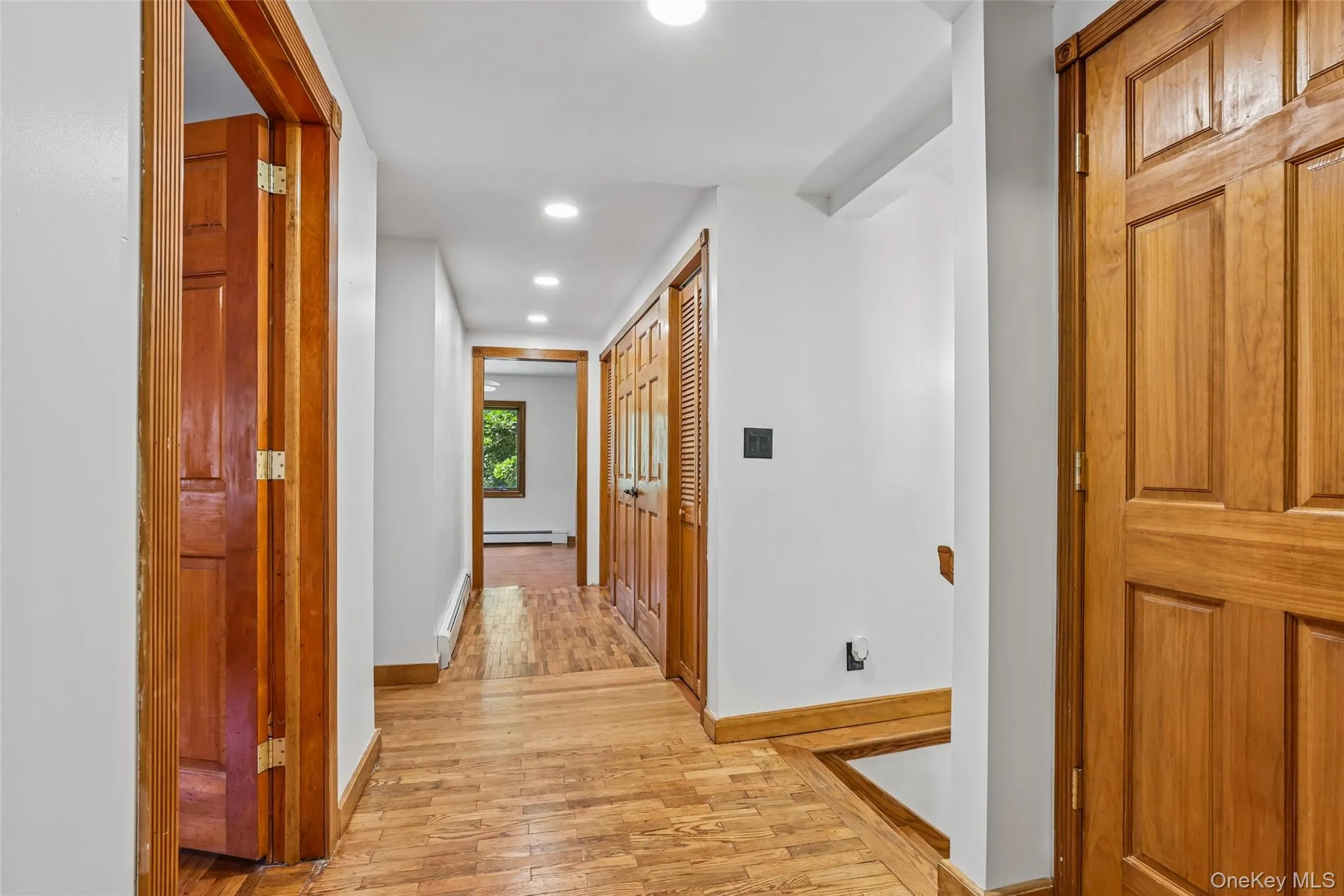 Upstairs hallway with closets and doorways Upstairs hallway with closets and doorways