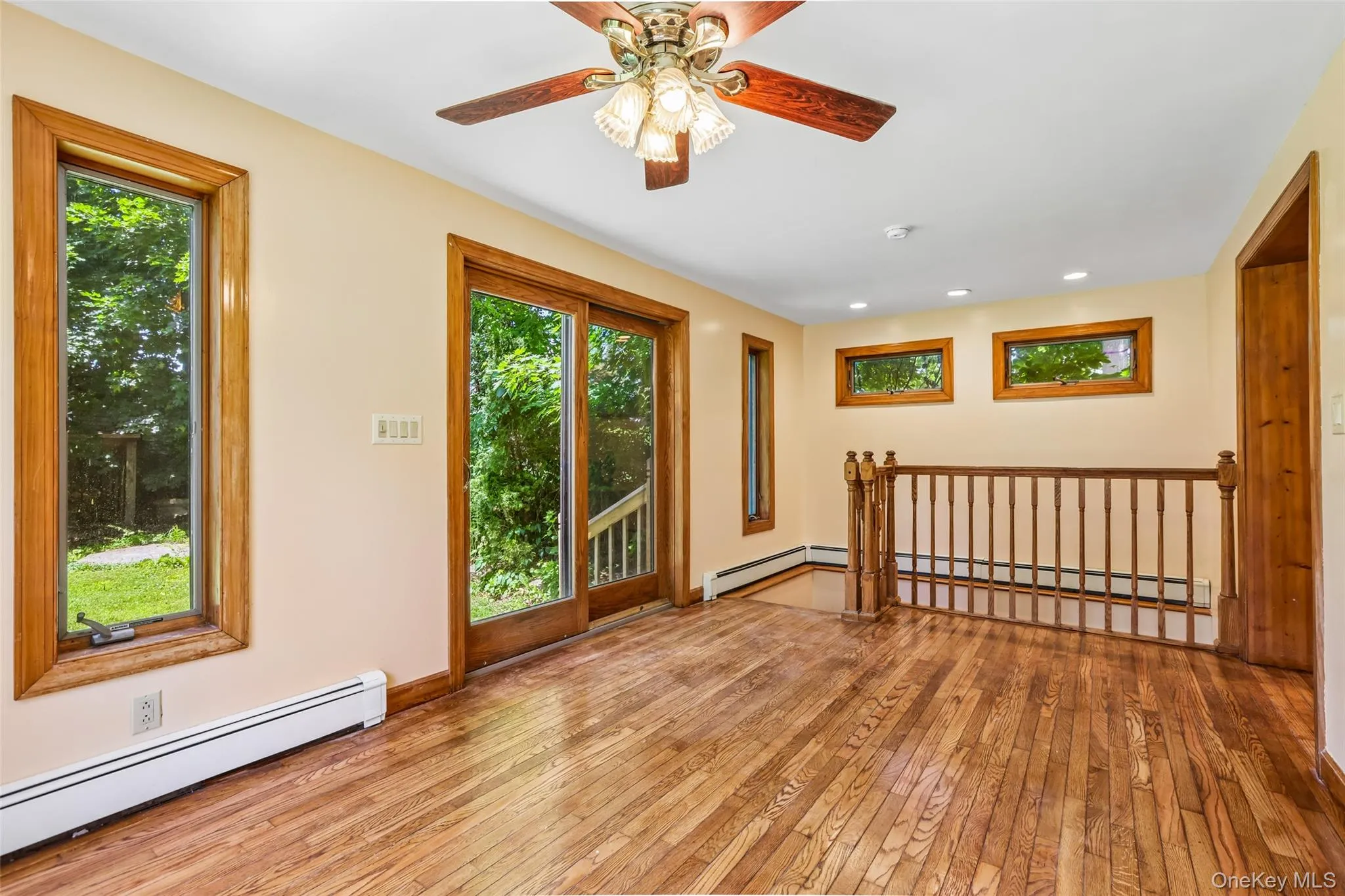 Family room or eating area off of kitchen with sliding glass door side entrance and stairs to the basement Family room or eating area off of kitchen with sliding glass door side entrance and stairs to the basement