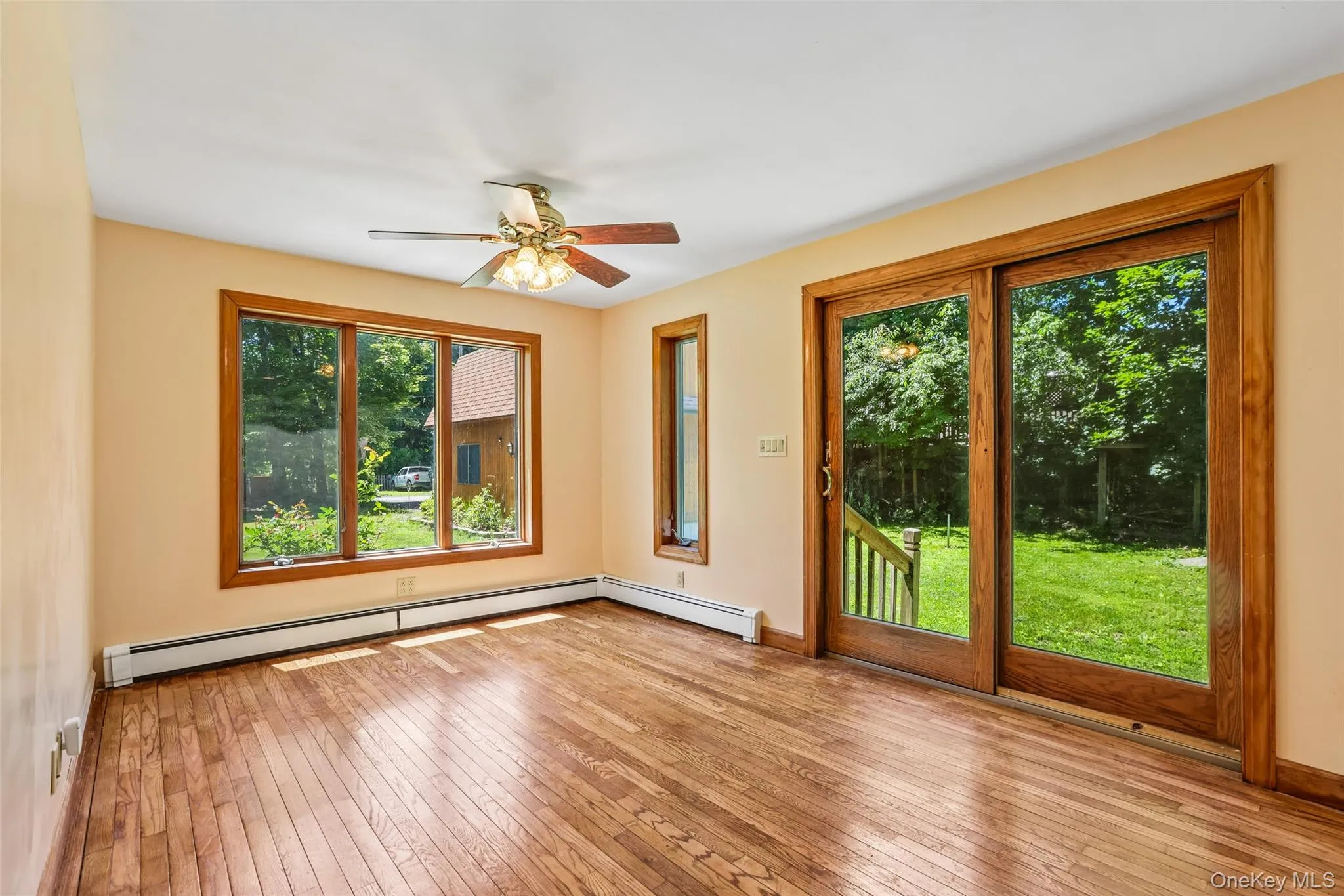 Family room off of the kitchen with sliding glass door side entrance Family room off of the kitchen with sliding glass door side entrance