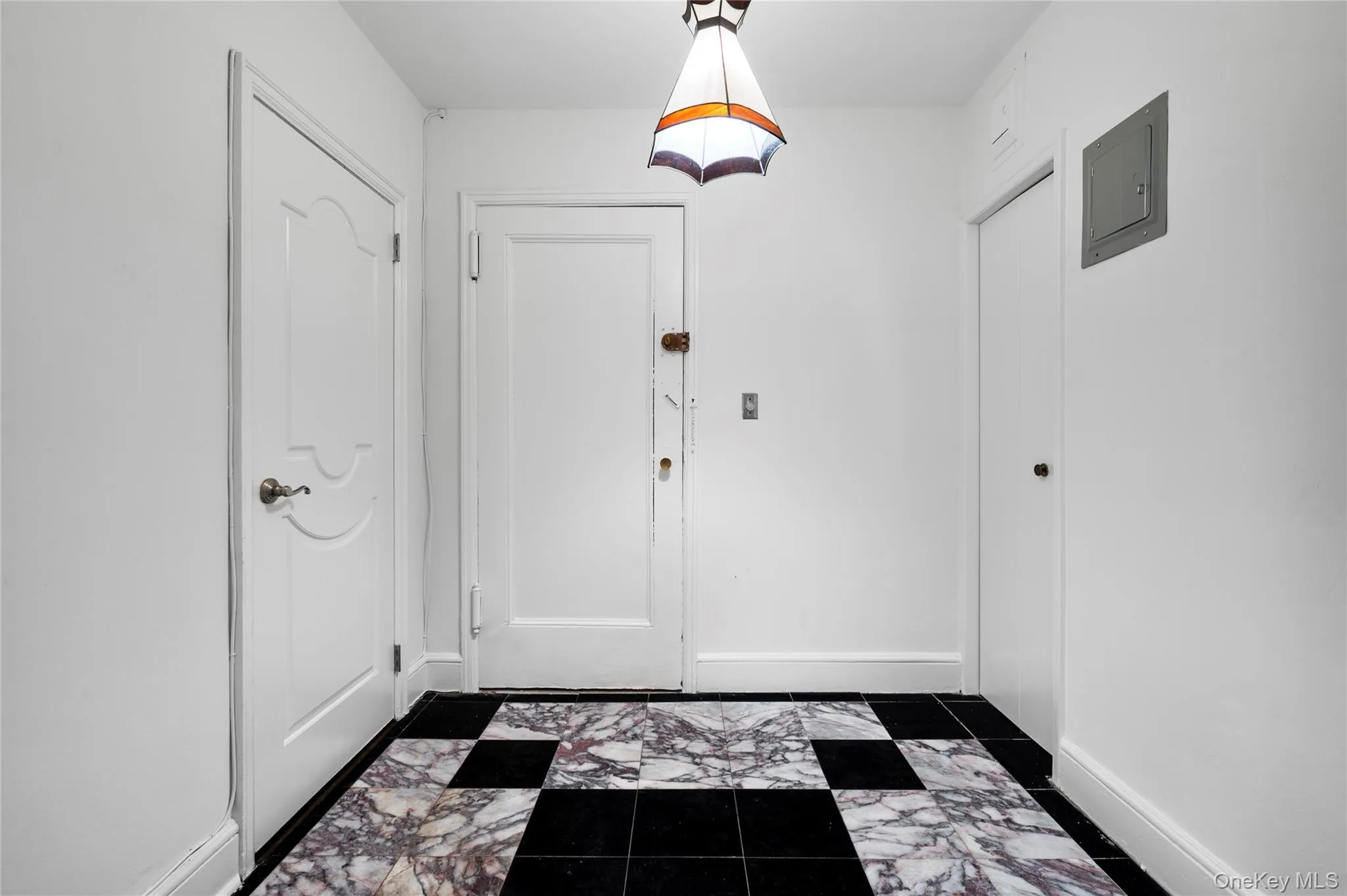 Etrance Foyer with two generous size closets and marble flooring Etrance Foyer with two generous size closets and marble flooring