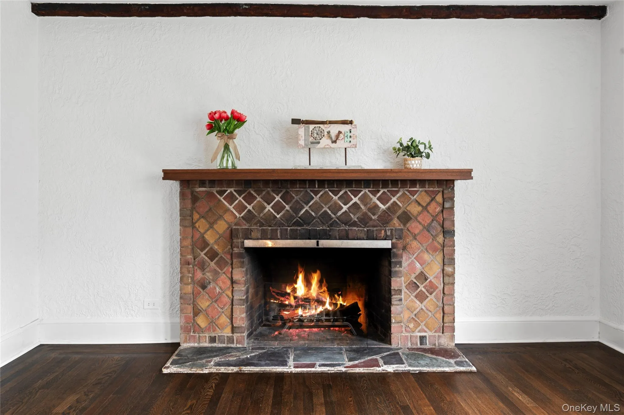 A beautifully crafted brick fireplace adds warmth, charm, and a welcoming ambiance to this co-op A beautifully crafted brick fireplace adds warmth, charm, and a welcoming ambiance to this co-op