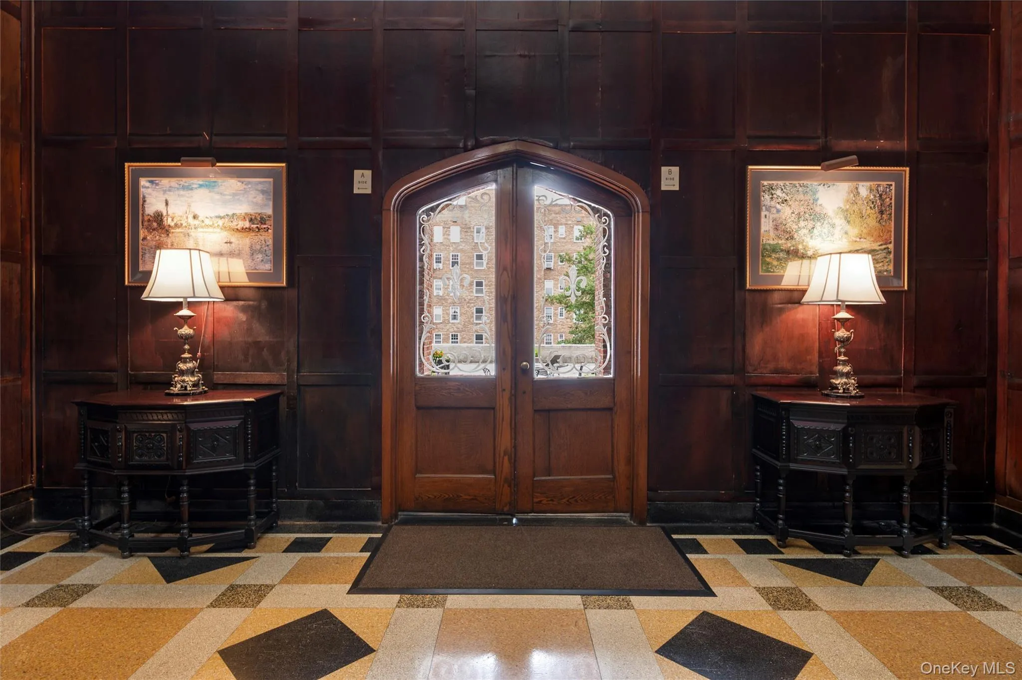 Historic-inspired lobby entrance with warm wood finishes, elegant fixtures, and distinctive architectural charm Historic-inspired lobby entrance with warm wood finishes, elegant fixtures, and distinctive architectural charm