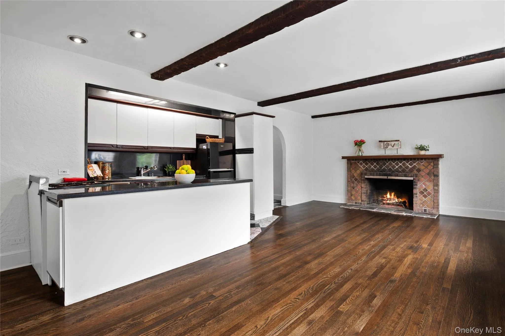 A dining area situated across from the kitchen offers both convenience and easy flow A dining area situated across from the kitchen offers both convenience and easy flow