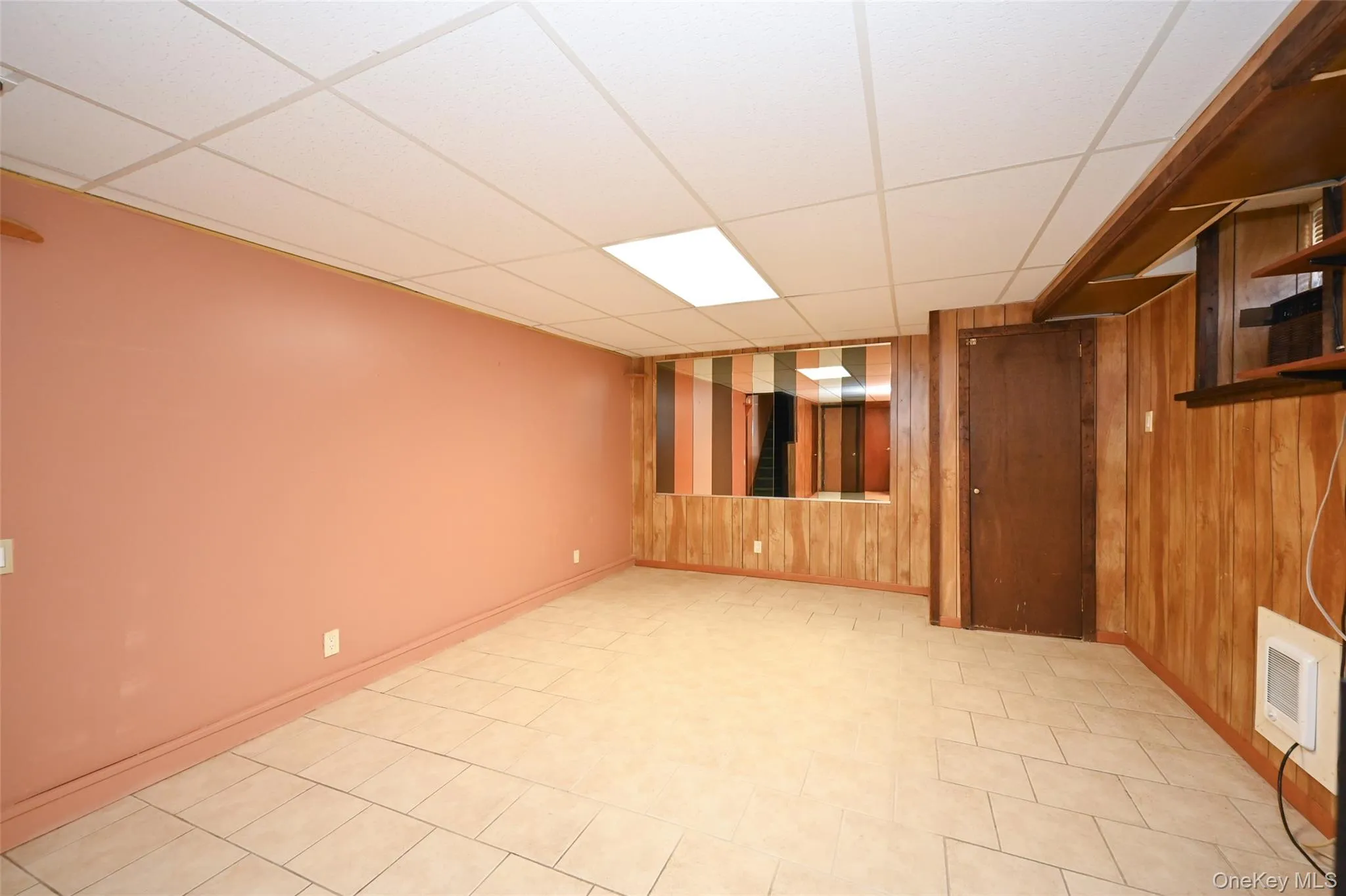 Basement with tiled flooring. Basement with tiled flooring.