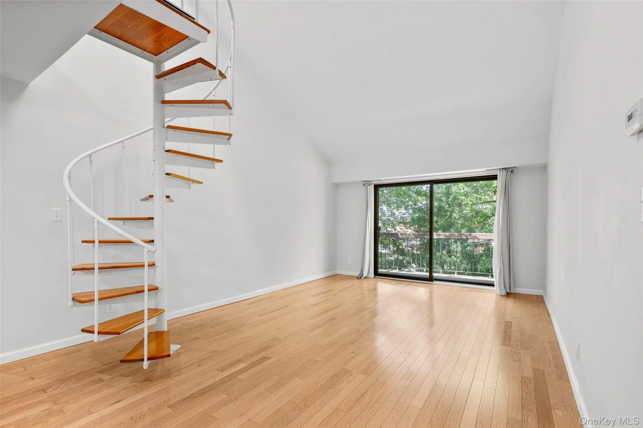 LR w/ Spiral Staircase to Loft LR w/ Spiral Staircase to Loft