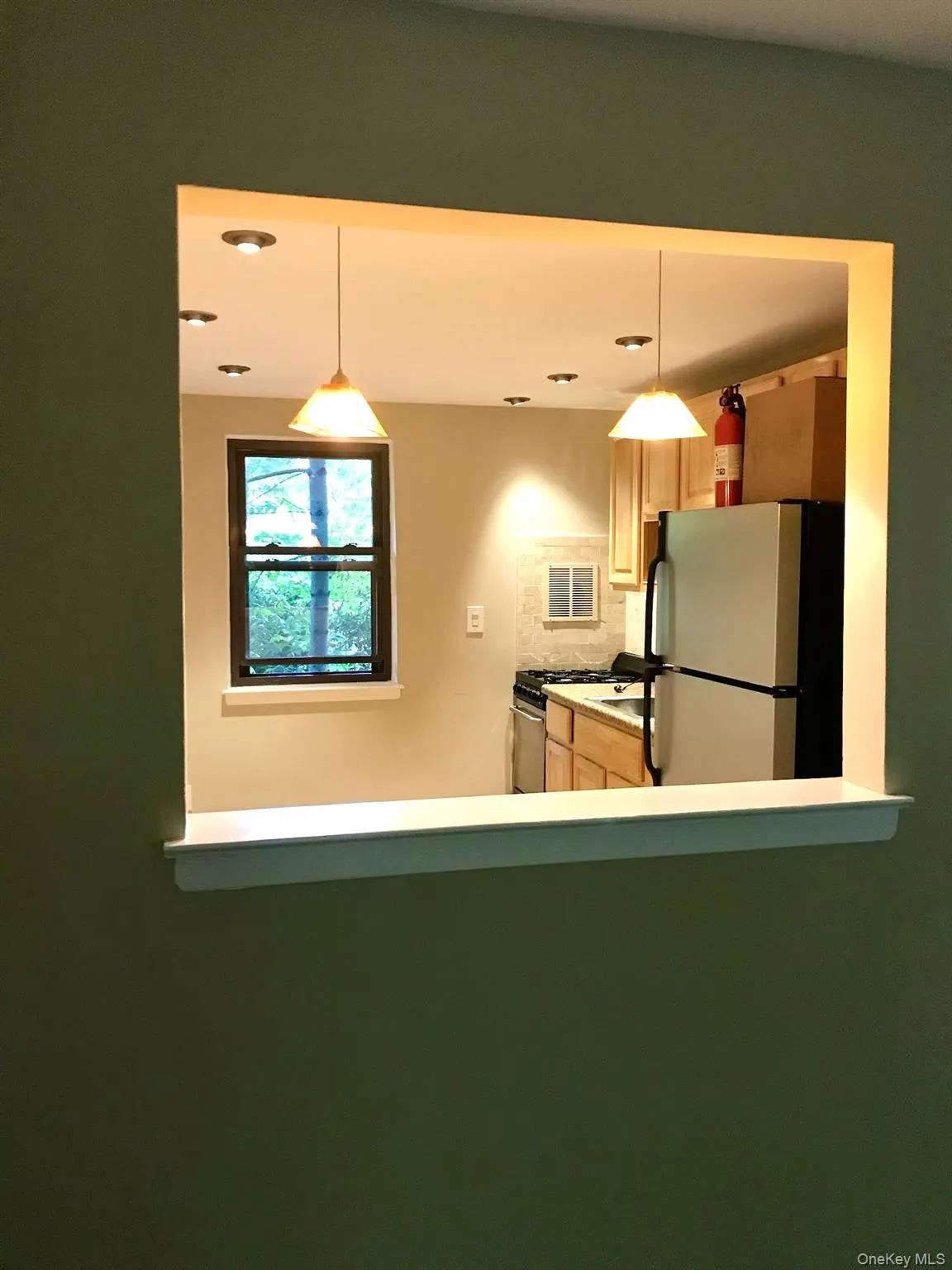 Kitchen pass-through window with a built-in shelf Kitchen pass-through window with a built-in shelf