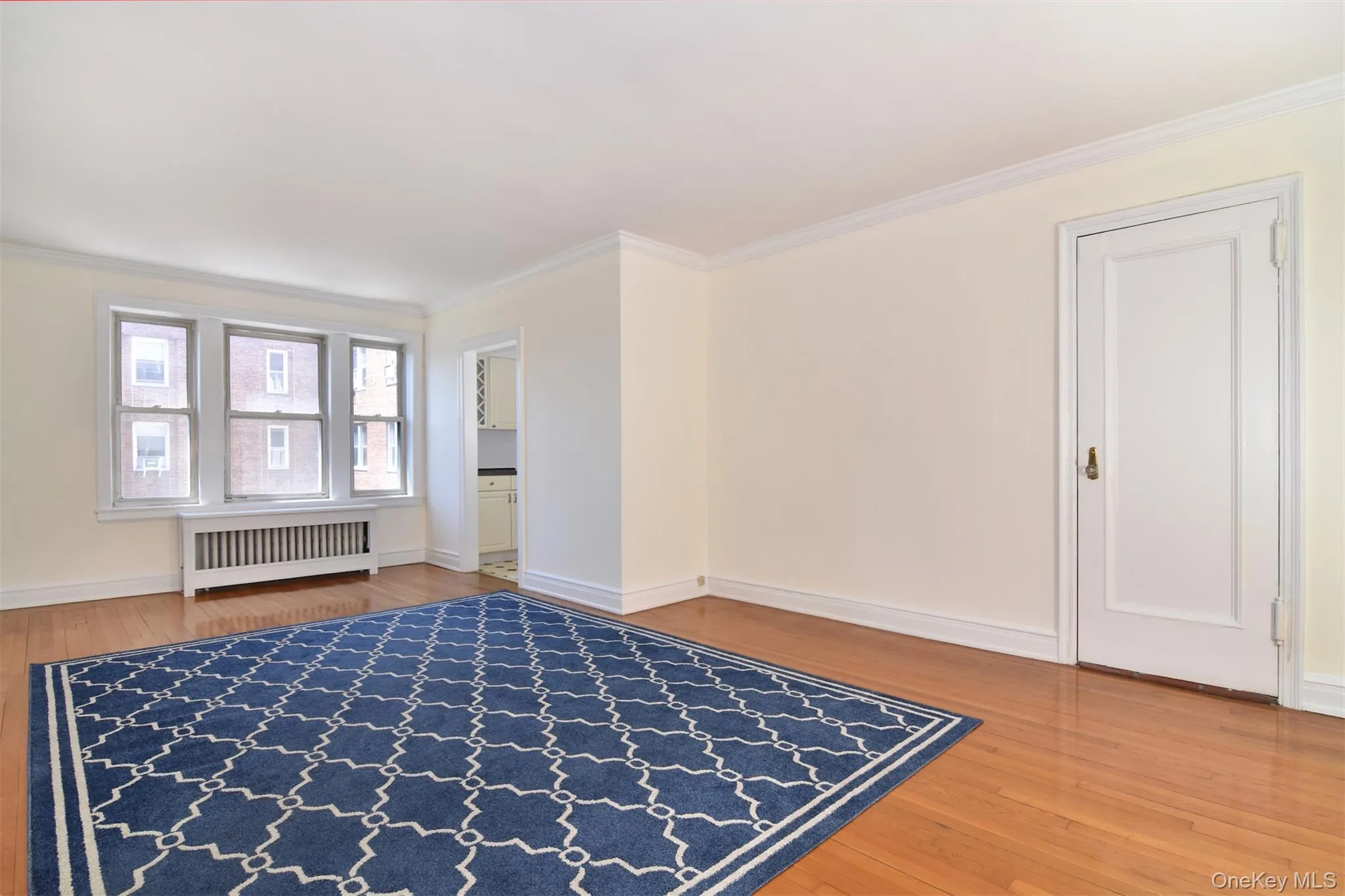 Original hardwood floors add warmth and character, while large windows fill the space with natural light. Custom radiator covers provide an attractive finishing touch throughout. Original hardwood floors add warmth and character, while large windows fill the space with natural light. Custom radiator covers provide an attractive finishing touch throughout.