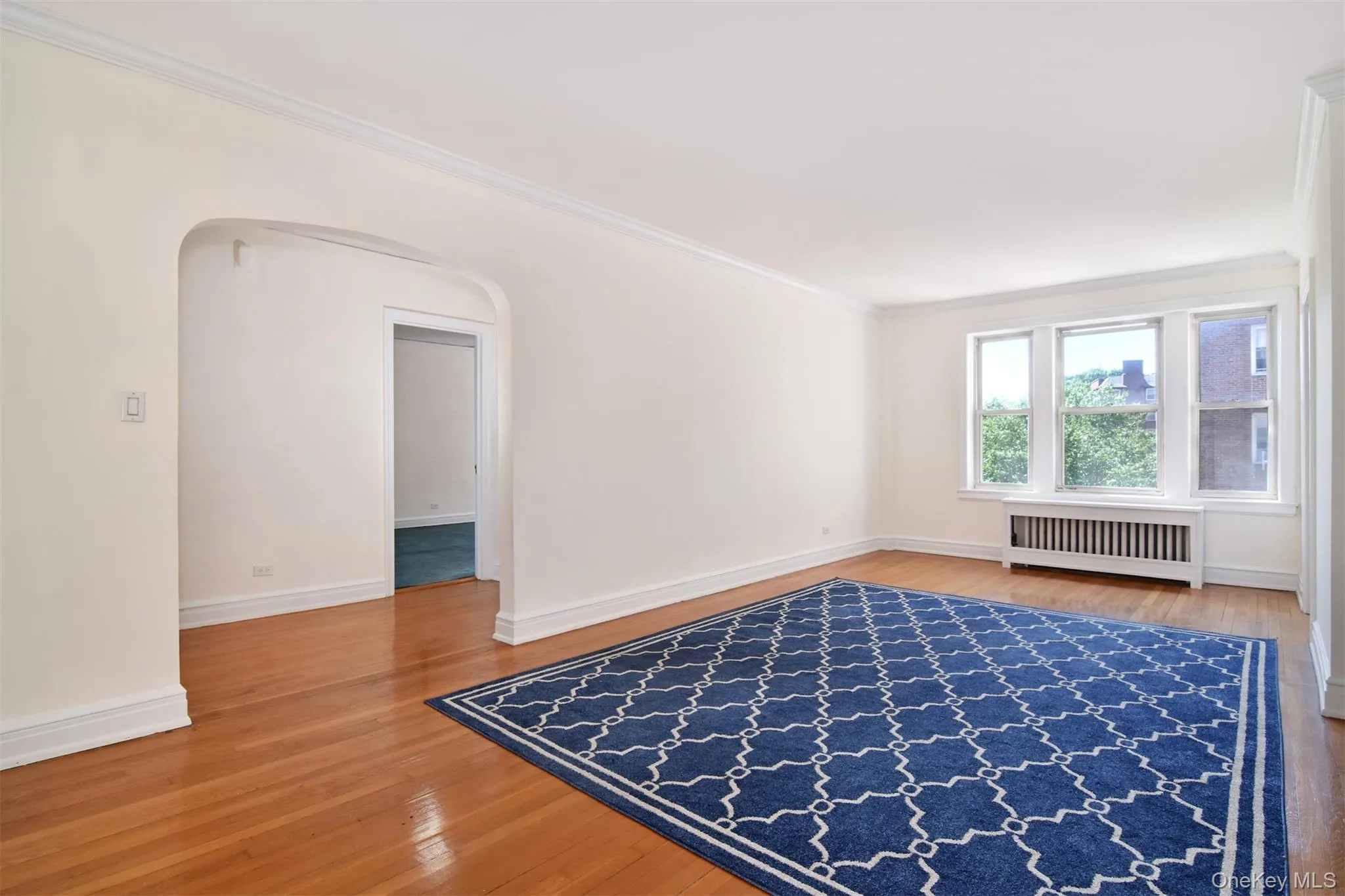 The apartment welcomes you with an entry foyer that opens into a spacious living and dining area. The apartment welcomes you with an entry foyer that opens into a spacious living and dining area.