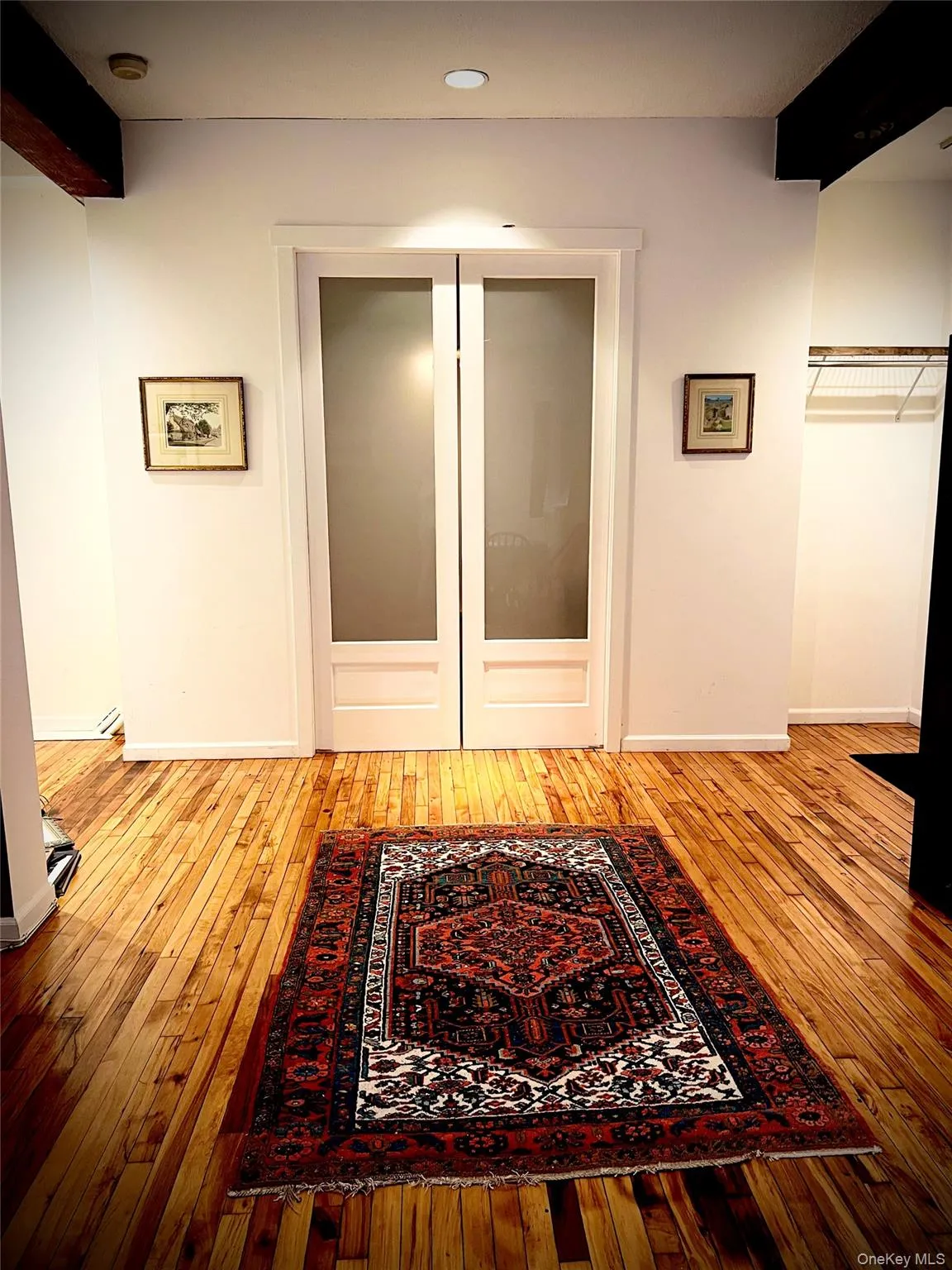 Hallway featuring light hardwood / wood-style flooring Hallway featuring light hardwood / wood-style flooring