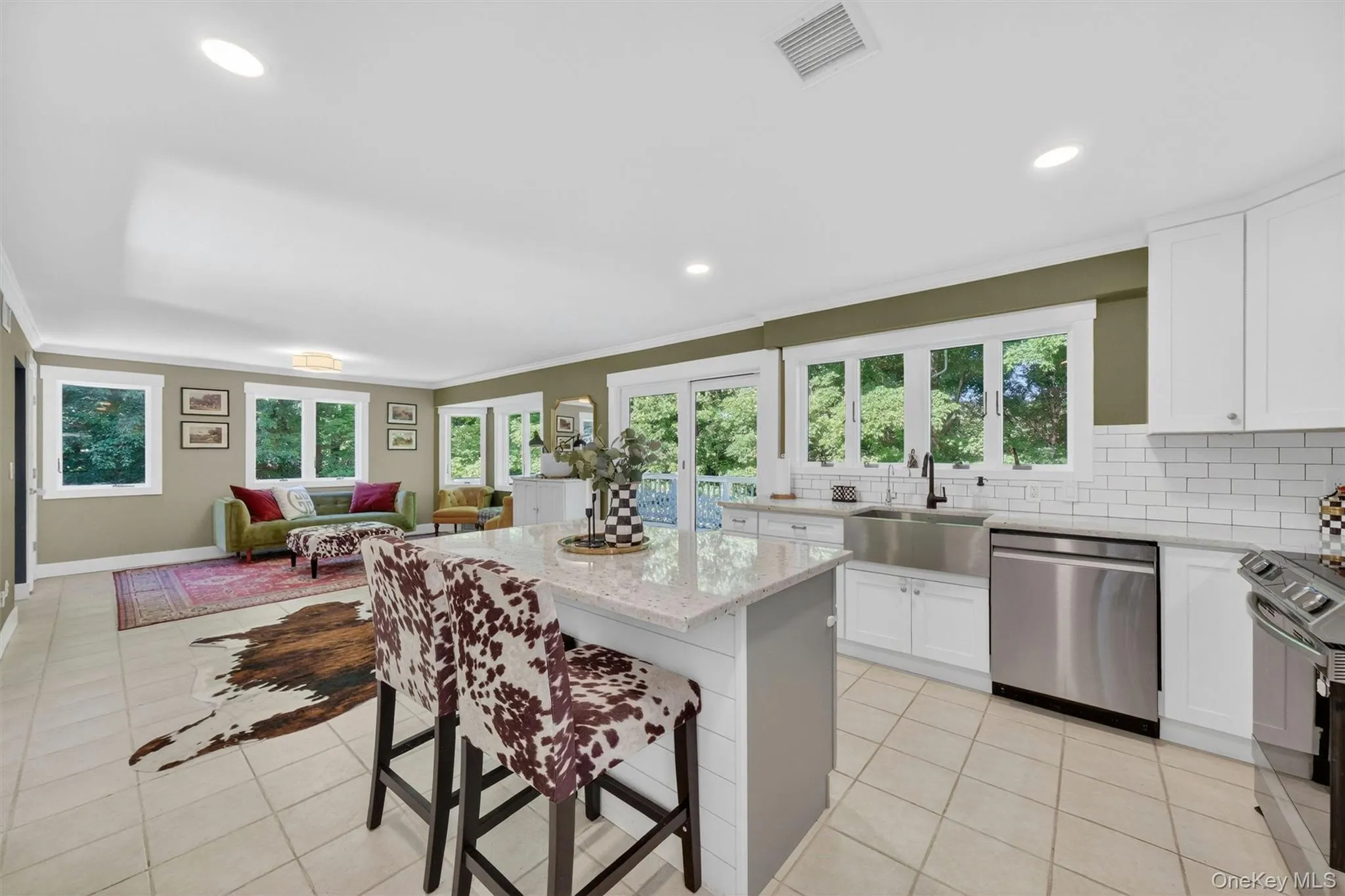 Large center island offering ample prep & seating space. Large center island offering ample prep & seating space.