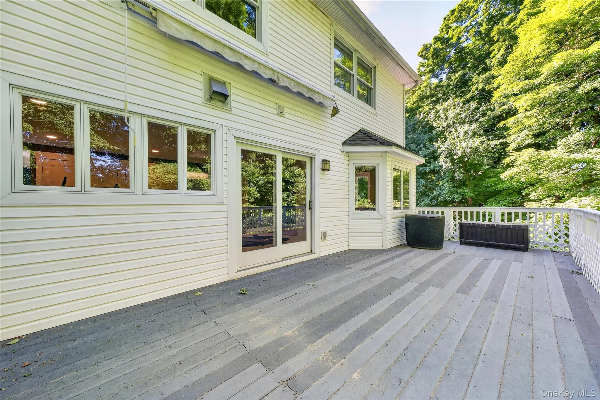 Sliders lead to a large trex deck perfect for grilling & entertaining. Sliders lead to a large trex deck perfect for grilling & entertaining.