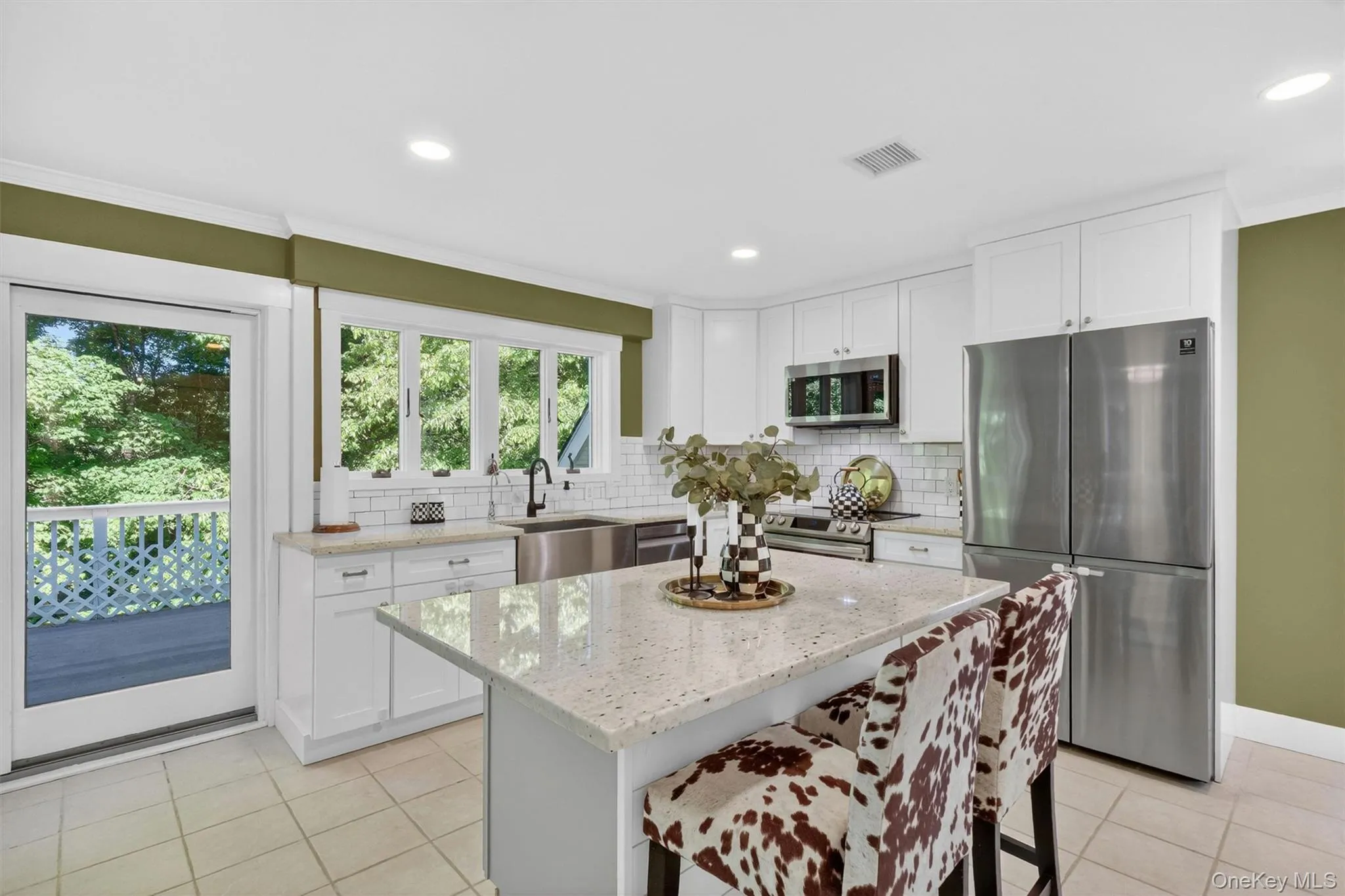 Sun filled Kitchen with stunning granite counters & radiant heated flooring. Sun filled Kitchen with stunning granite counters & radiant heated flooring.