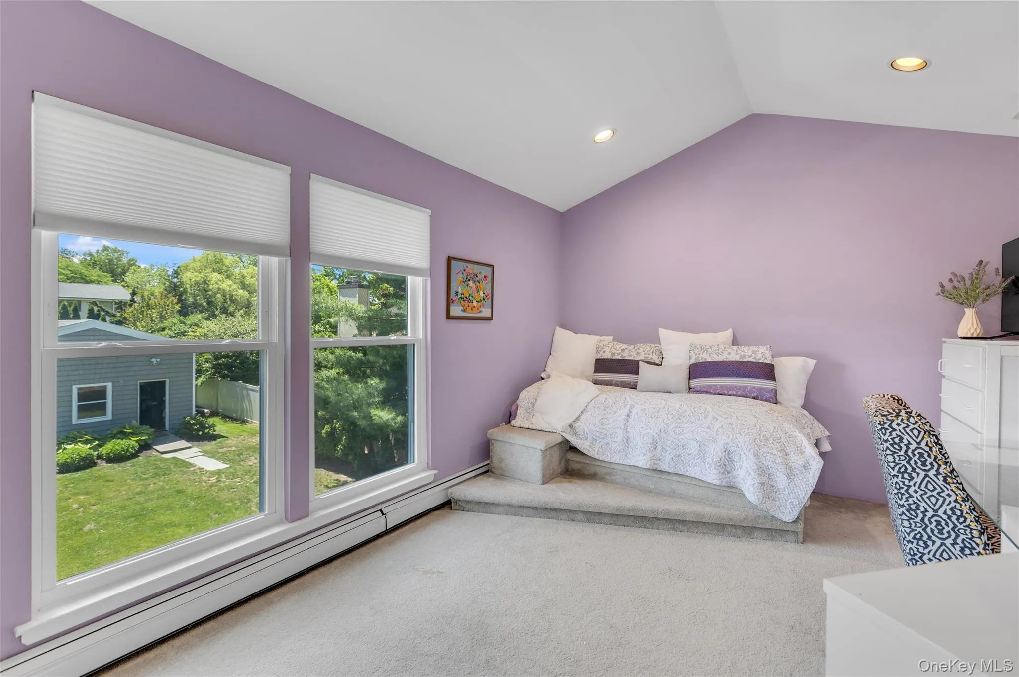 Interior room featuring a vaulted ceiling with recessed lighting Interior room featuring a vaulted ceiling with recessed lighting