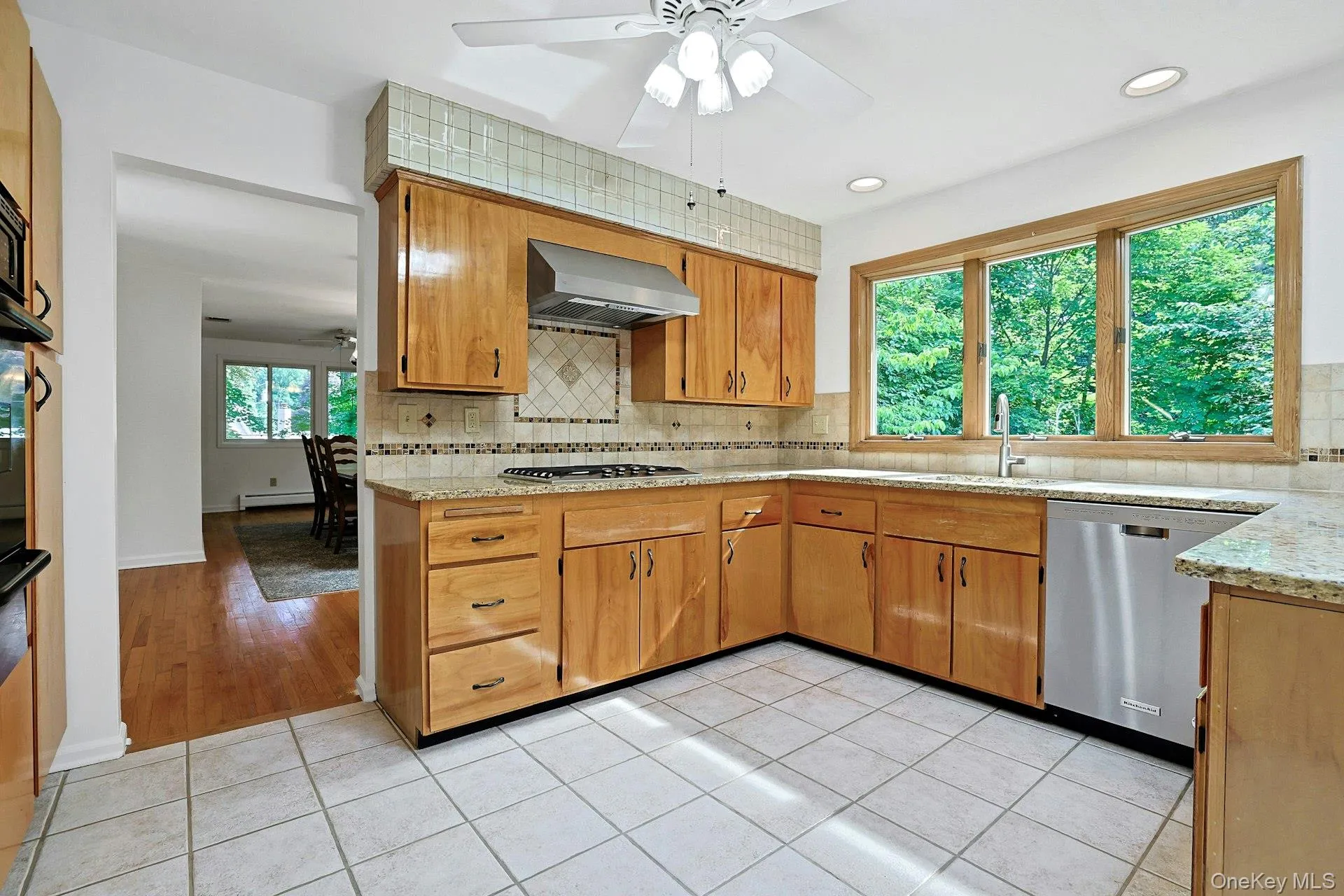 Granite countertops and stainless steel cooktop, wall oven and dishwasher. Granite countertops and stainless steel cooktop, wall oven and dishwasher.