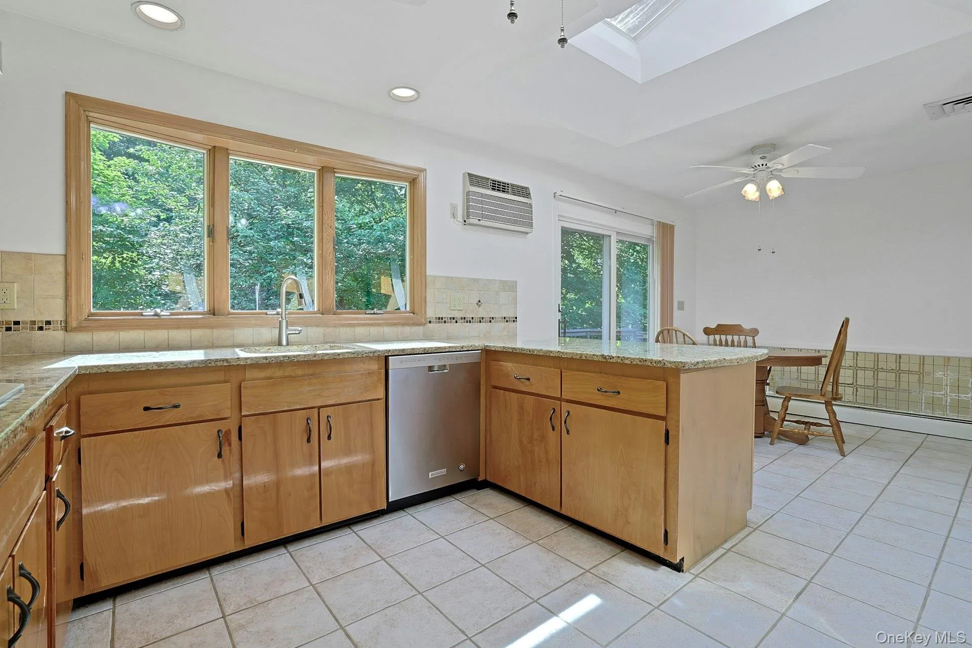 Andersen triple casement windows overlook the deck and backyard. Andersen triple casement windows overlook the deck and backyard.