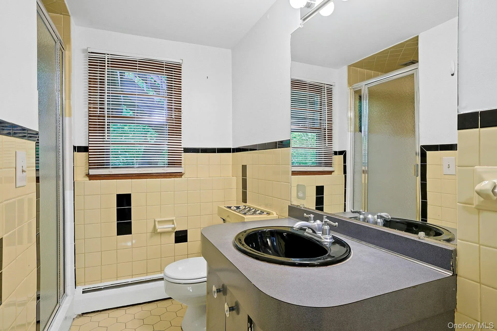 The lower level bathroom is a full bath with shower stall. The lower level bathroom is a full bath with shower stall.