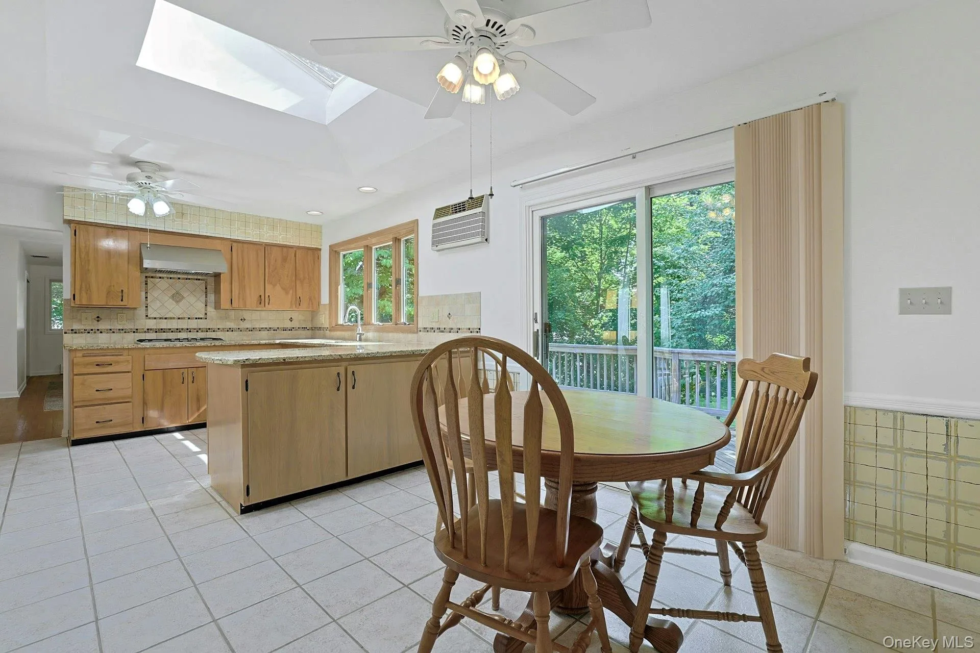 There is also a large skylight and slider to the expansive deck. There is also a large skylight and slider to the expansive deck.
