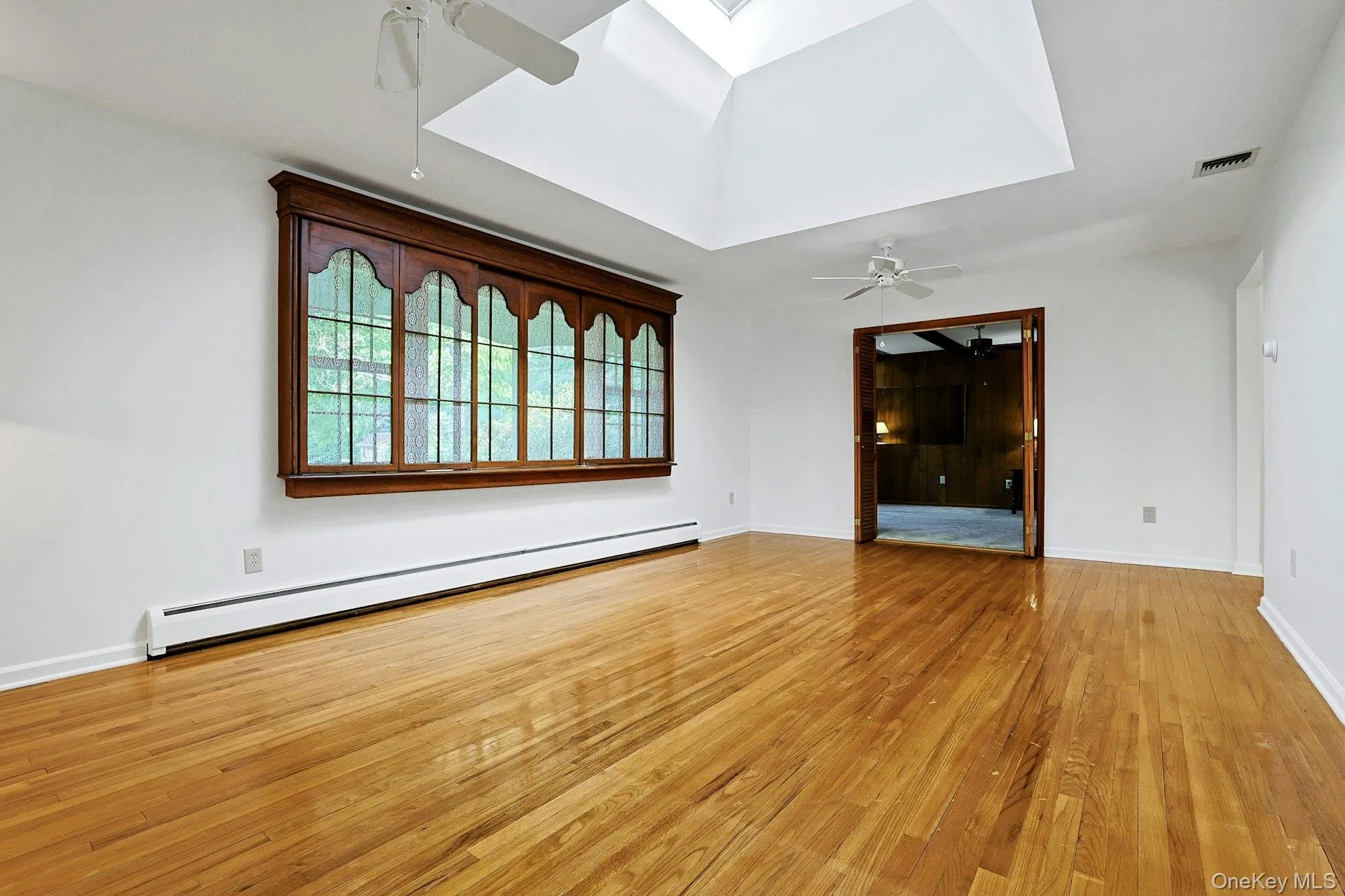 The opening at the end of the room leads to the main floor Family Room. The opening at the end of the room leads to the main floor Family Room.