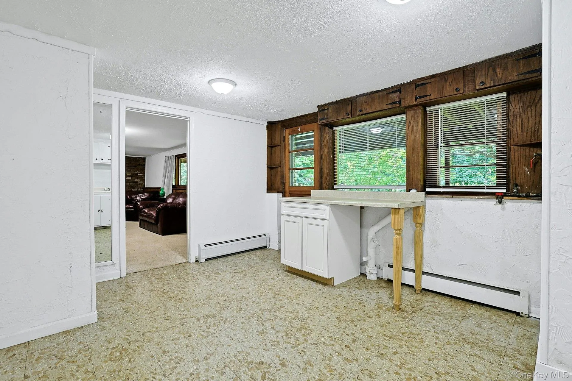 This room has cabinetry, a sink and refrigerator (as is), which is convenient for entertaining downstairs or in the backyard. This room has cabinetry, a sink and refrigerator (as is), which is convenient for entertaining downstairs or in the backyard.