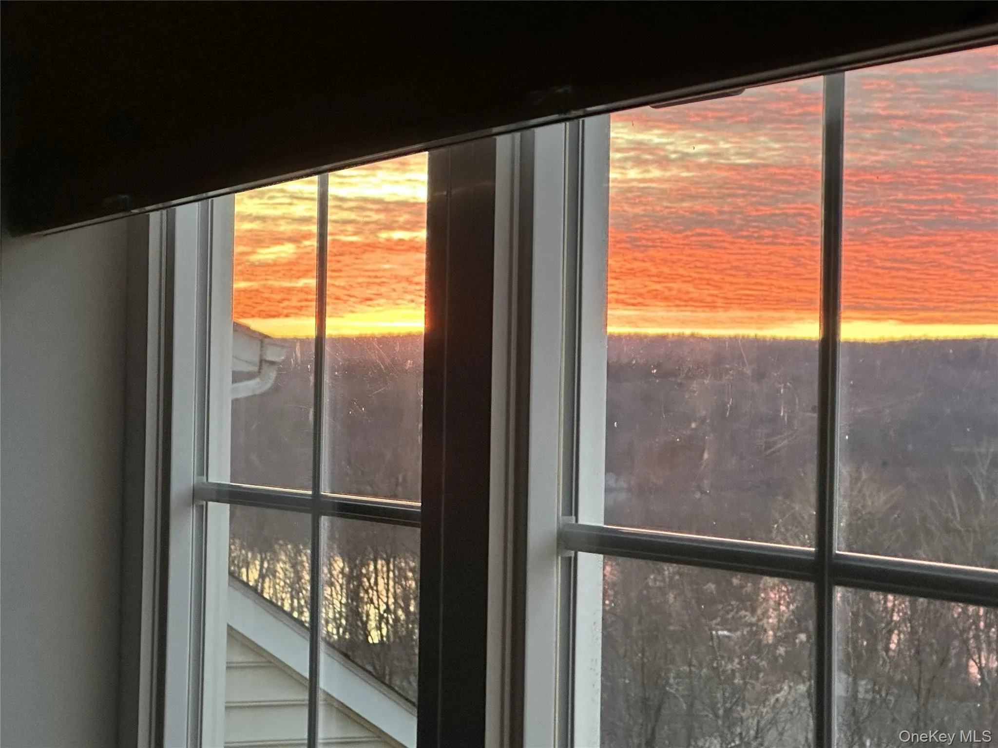 Beautiful sunset view from primary bedroom Beautiful sunset view from primary bedroom