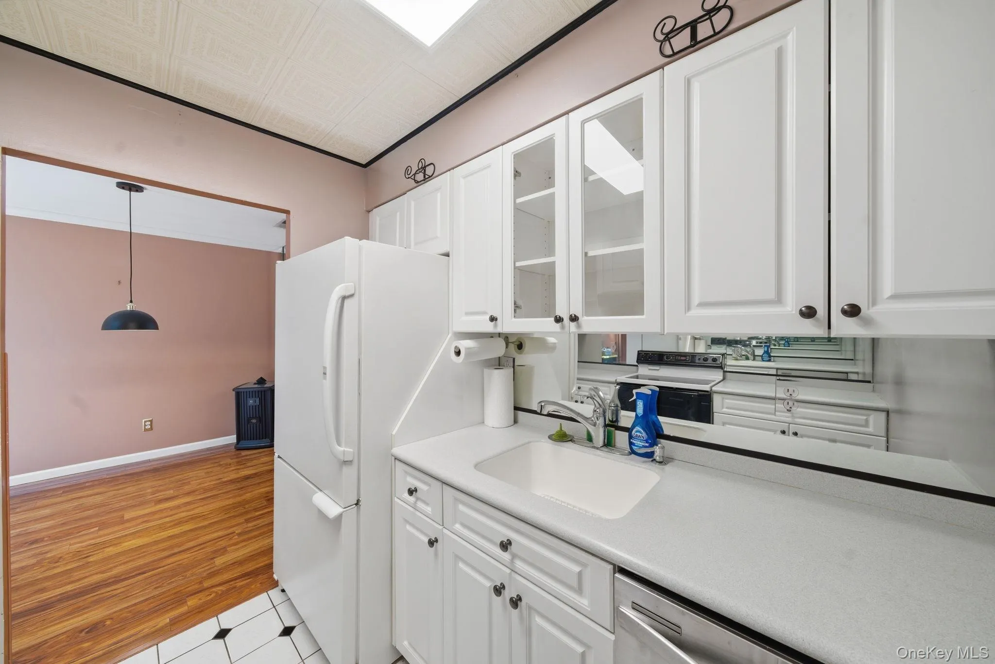 Functional kitchen with dishwasher and glass cabinets Functional kitchen with dishwasher and glass cabinets