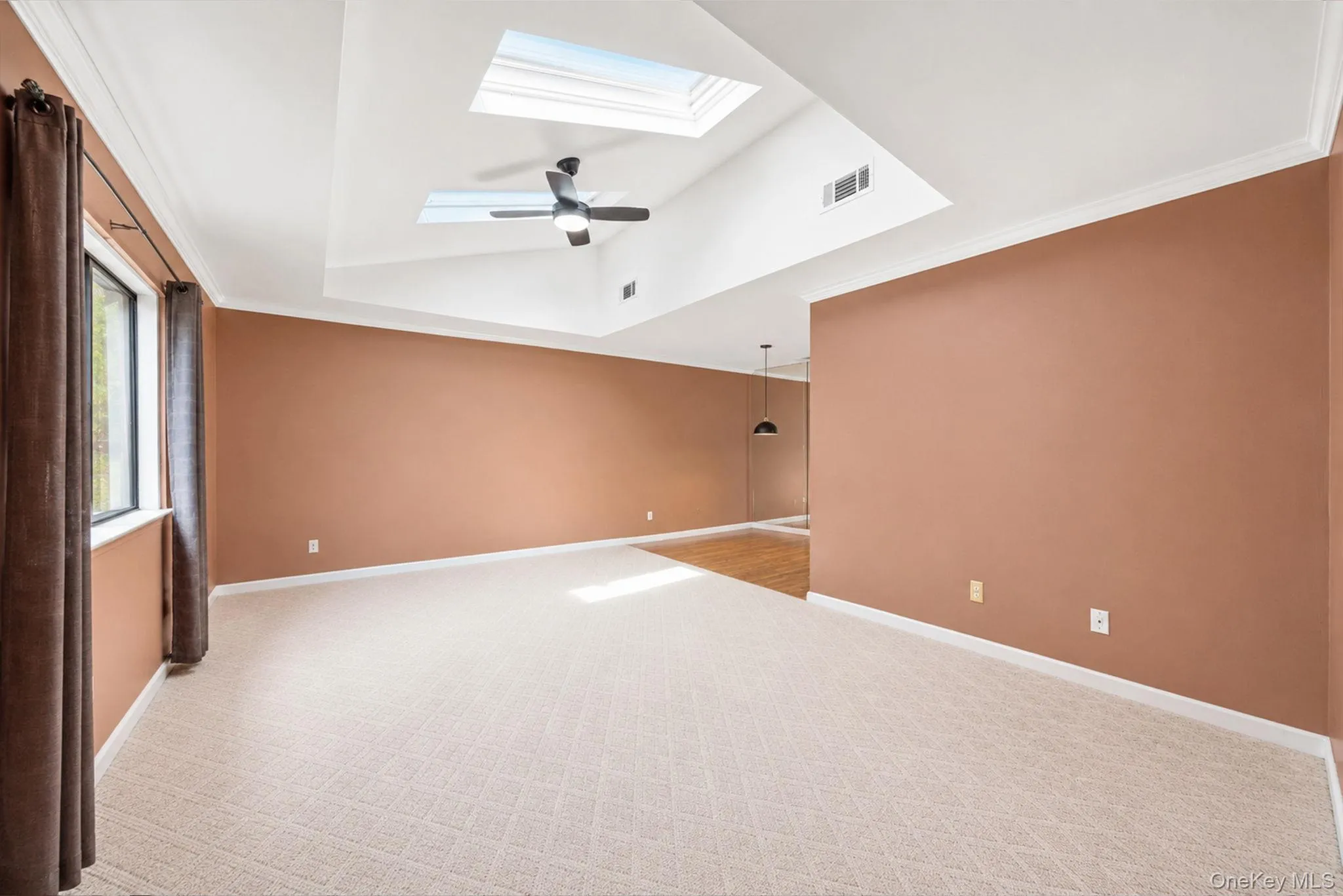 Living room featuring double functioning skylights. Living room featuring double functioning skylights.