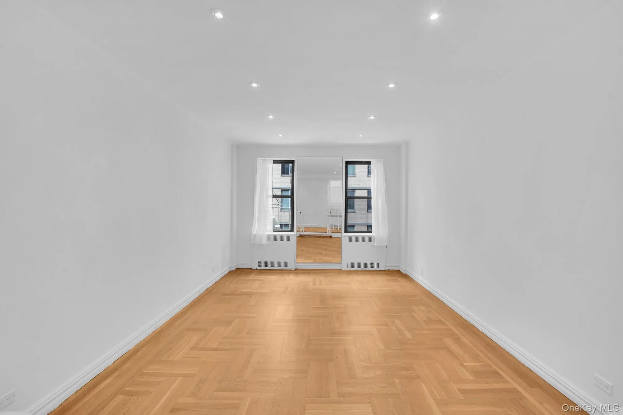 Sunken living room featuring hardwood floors Sunken living room featuring hardwood floors