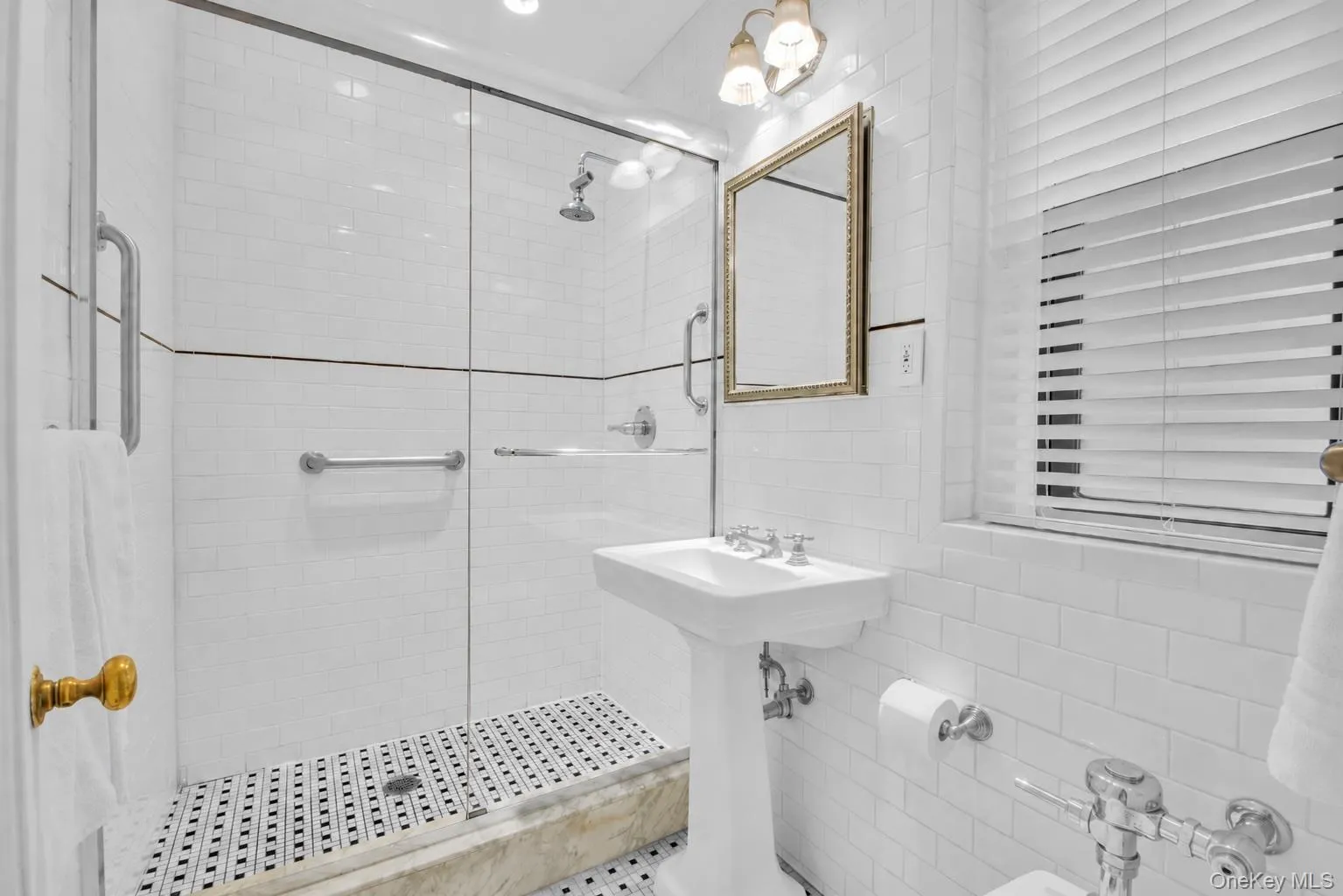 Windowed bathroom with tiled shower. Windowed bathroom with tiled shower.