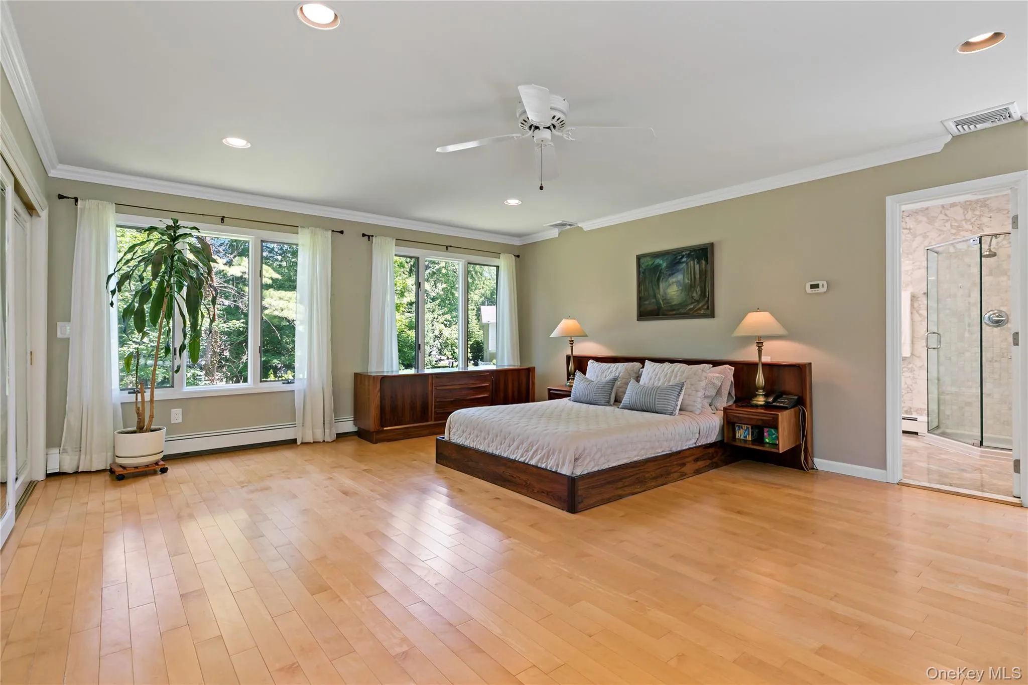 Expansive Primary Suite with walls of windows Expansive Primary Suite with walls of windows
