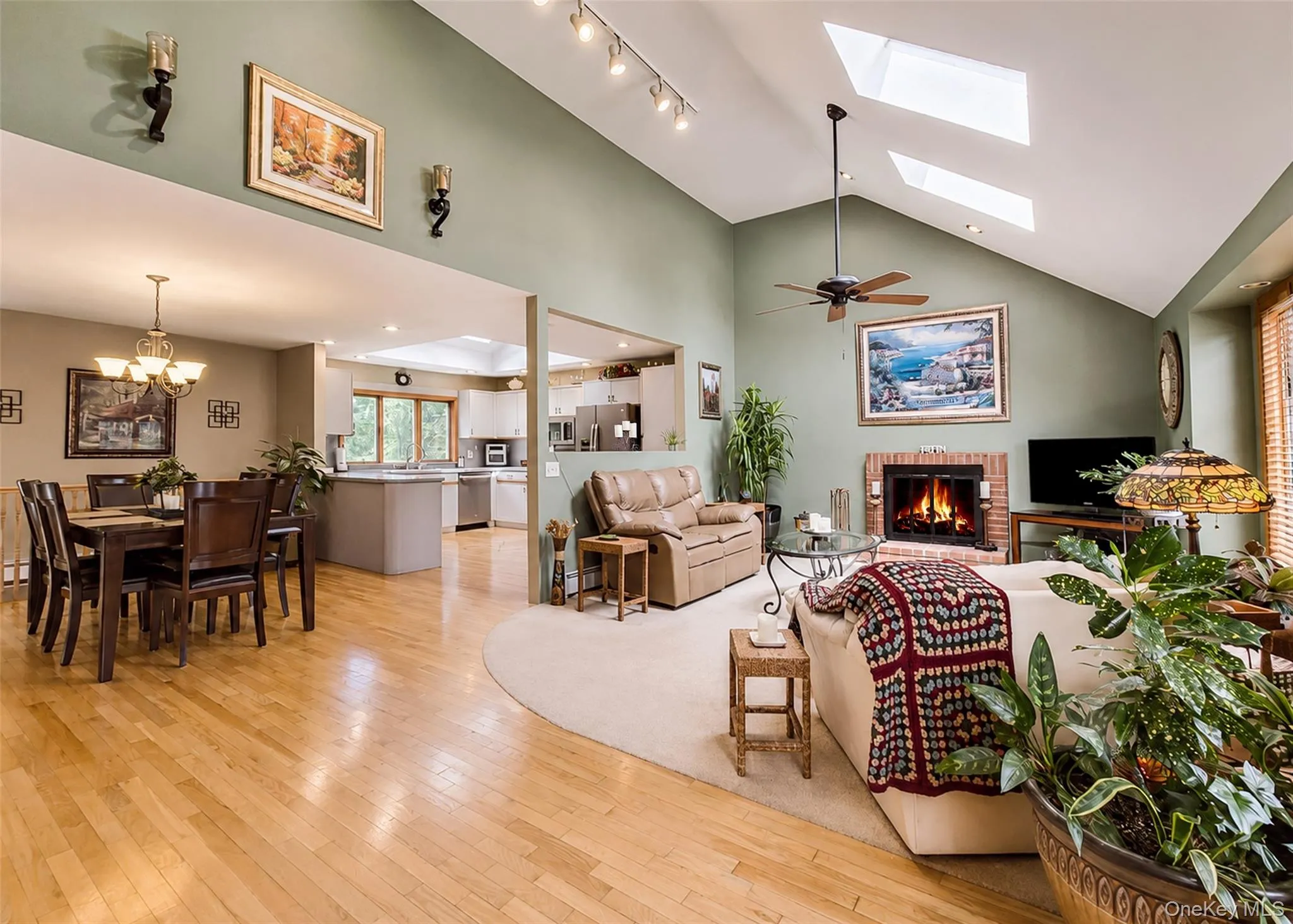 Living rm with Fireplace, Skylights, vaulted ceilings recessed & track lighting. Living rm with Fireplace, Skylights, vaulted ceilings recessed & track lighting.