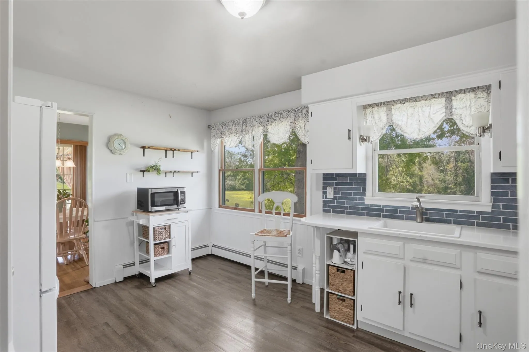 Eating area with window overlooking your park-like backyard. Eating area with window overlooking your park-like backyard.