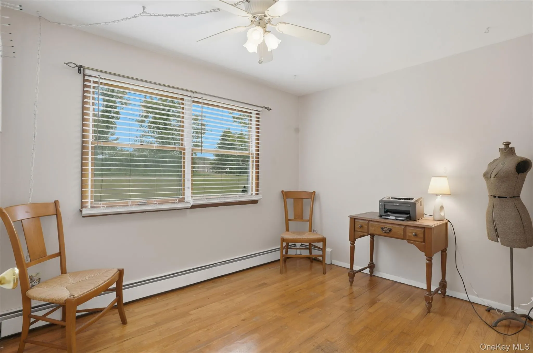 Bedroom 1 of 1 ~ wood floors, ceiling fan, and large window Bedroom 1 of 1 ~ wood floors, ceiling fan, and large window