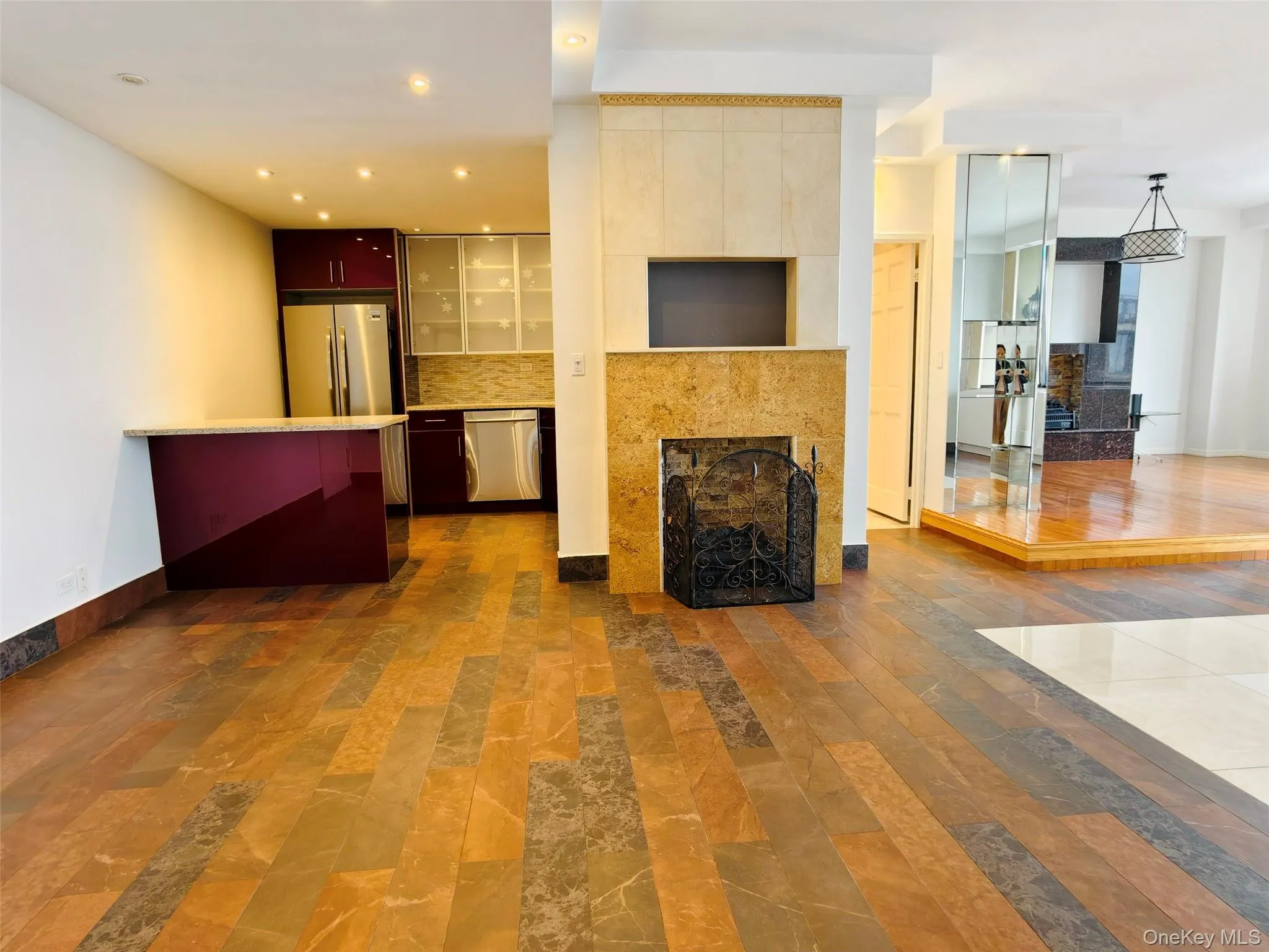 Living room featuring a fireplace and recessed lighting Living room featuring a fireplace and recessed lighting
