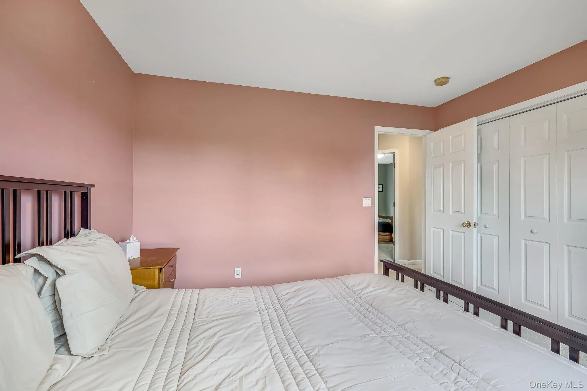 Spacious room highlights a closeet with double doors. Spacious room highlights a closeet with double doors.