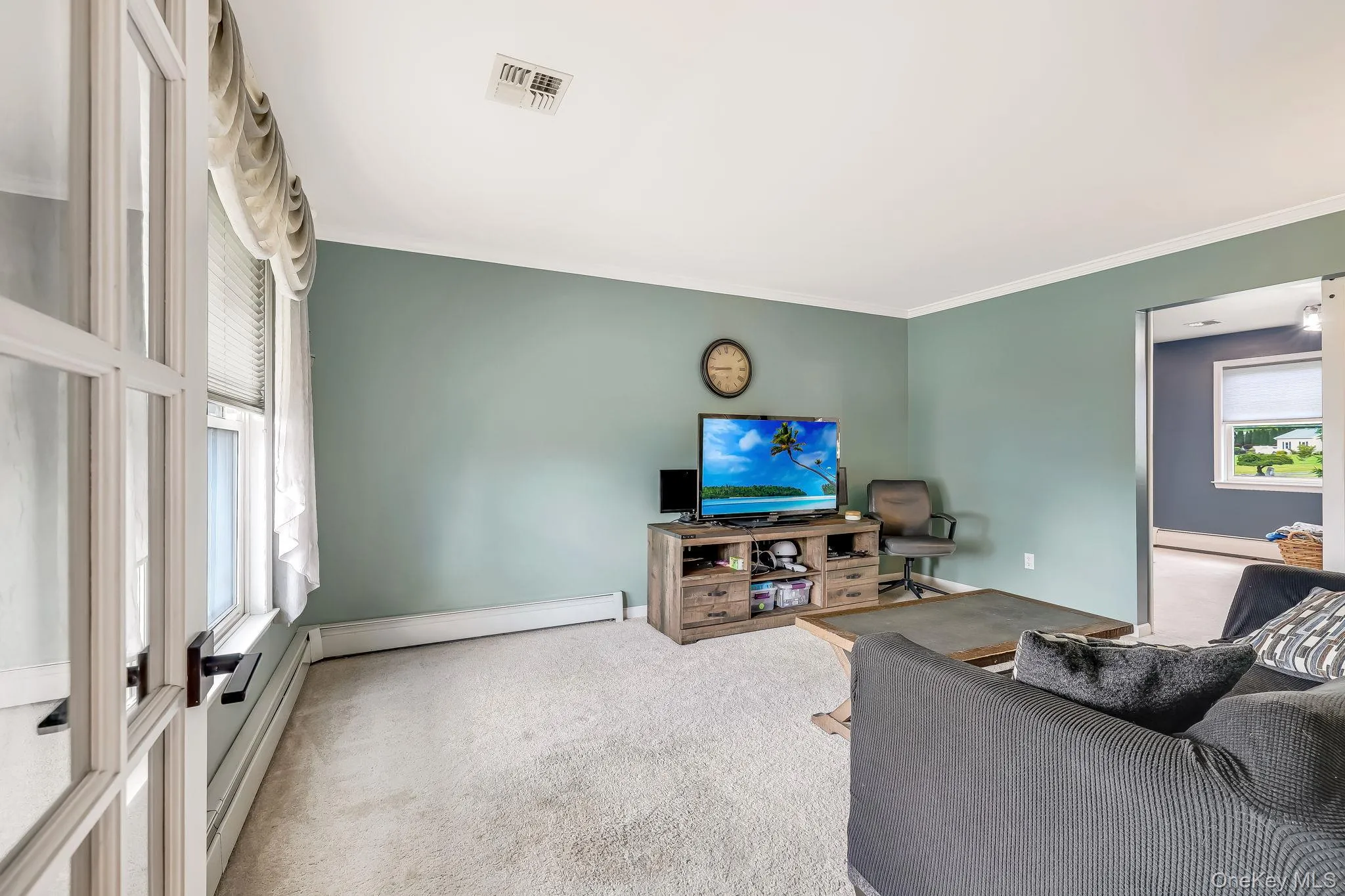 The sizable living room is a quiet spot to relax after a busy day. The sizable living room is a quiet spot to relax after a busy day.
