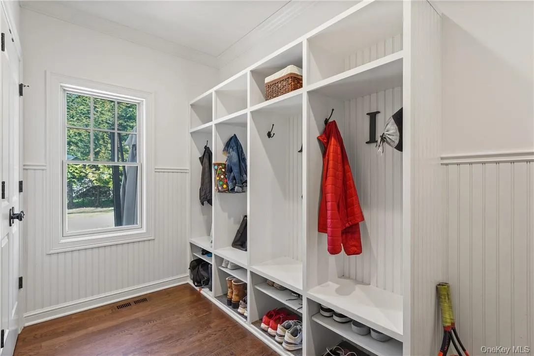 Mudroom outfitted with cubbies and closets Mudroom outfitted with cubbies and closets